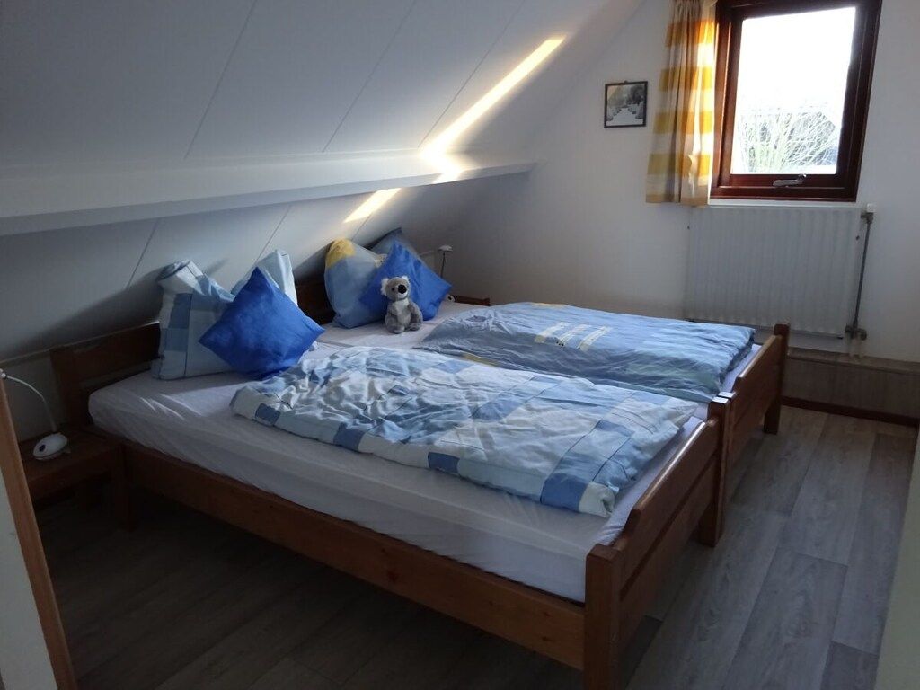 Een slaapkamer van 394165 in Ouddorp Zh