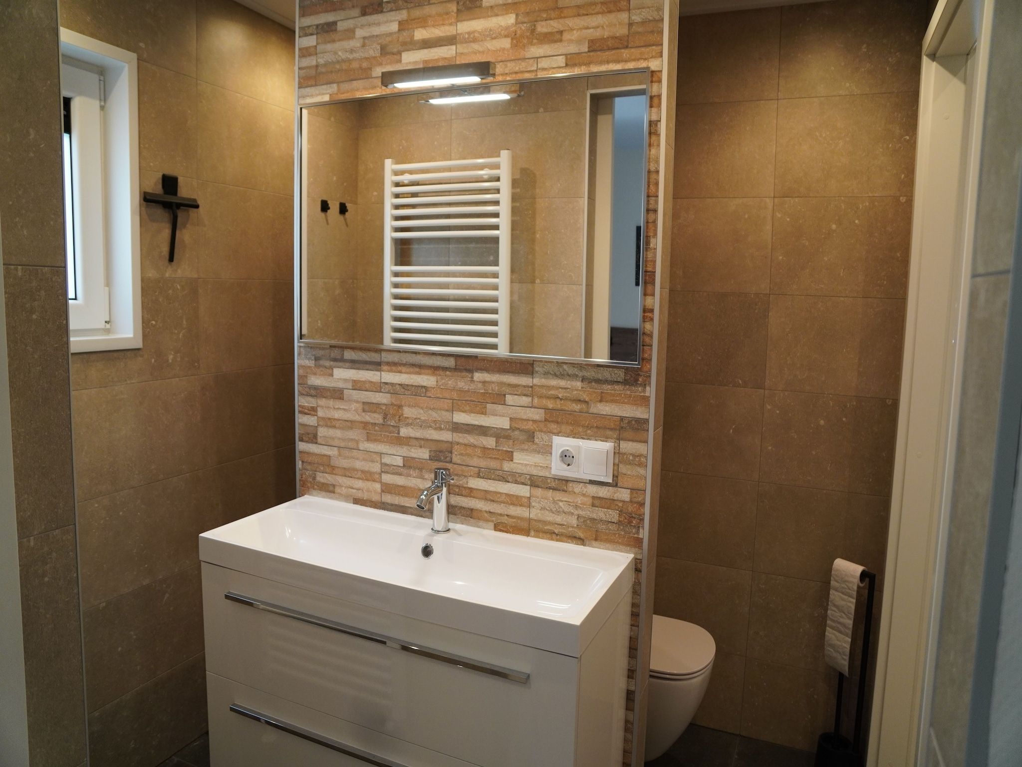 De badkamer van Vakantiepark De Rimboe & De Woeste Hoogte 25 in Hoenderloo