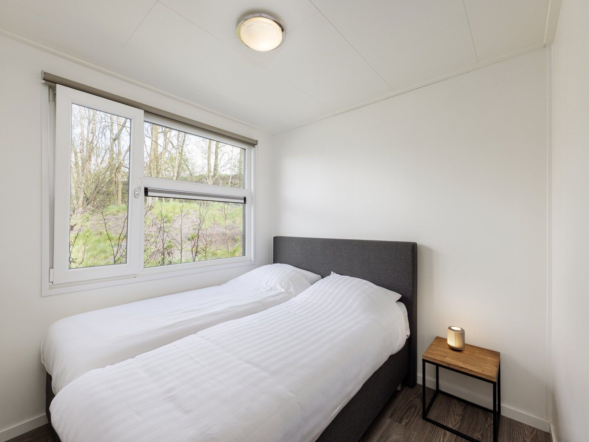 Een slaapkamer van Recreatiepark Tolplas 18 in Hoge Hexel