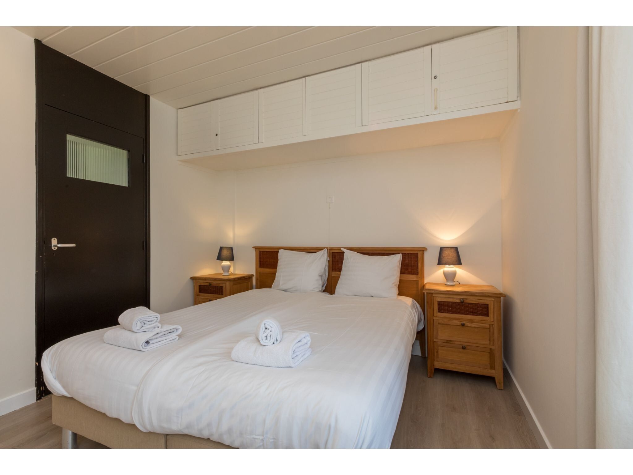 Een slaapkamer van Appartement - Burg van Woelderenlaan 100-4 in Vlissingen