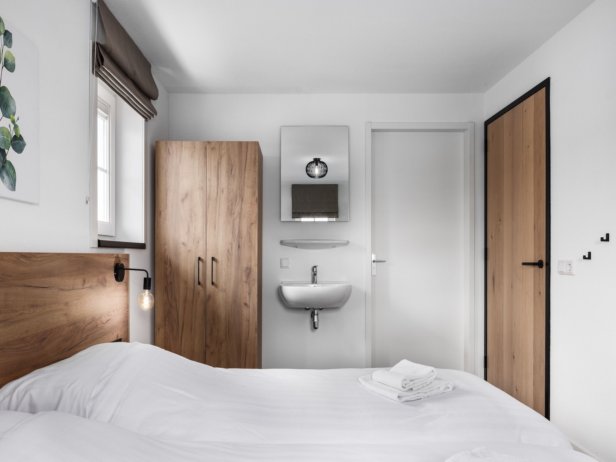 Een slaapkamer van Vakantiepark De Heihorsten 3 in Someren