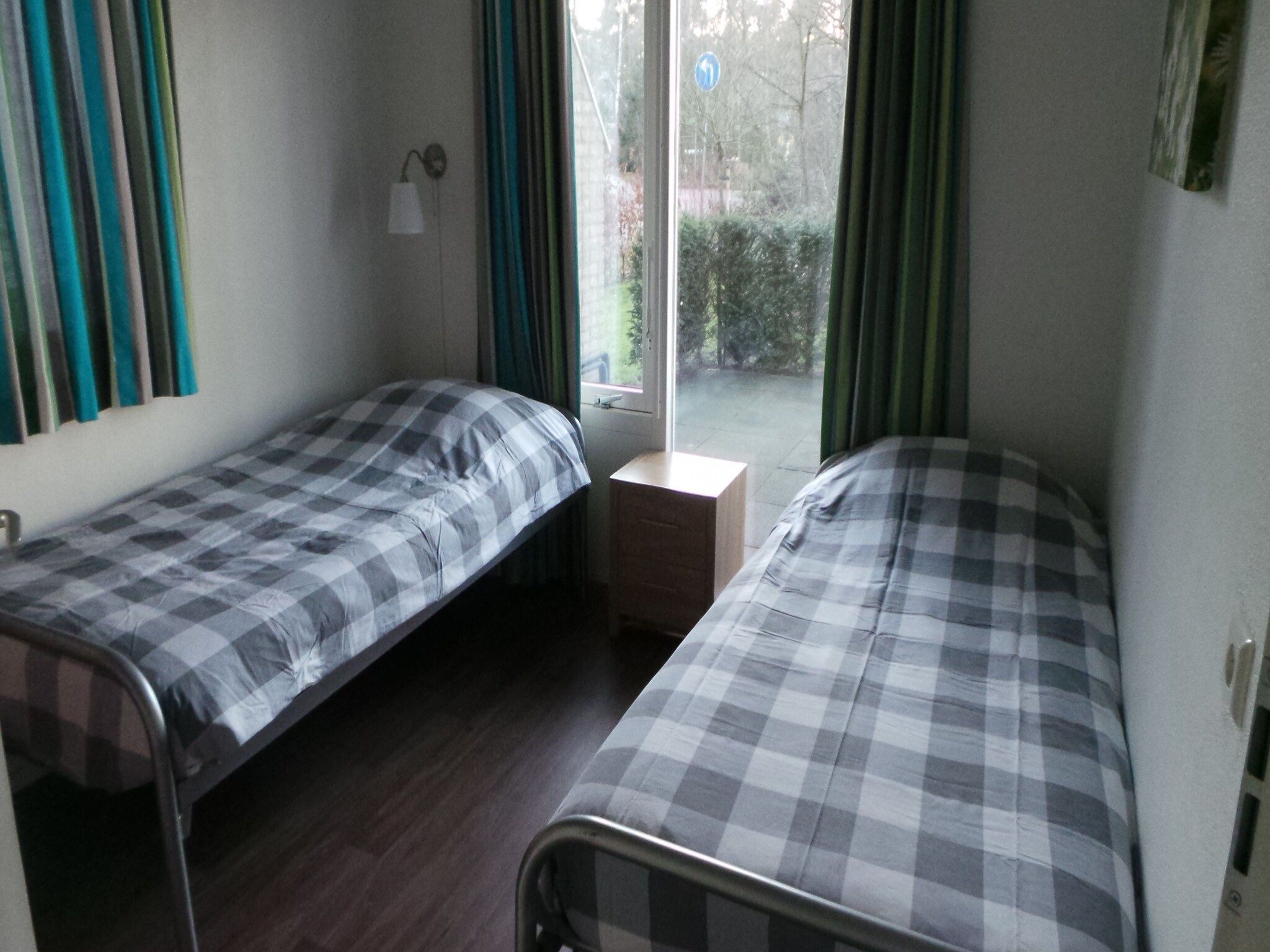 Een slaapkamer van Buitenplaats Berg en Bos nummer 15 in Lemele