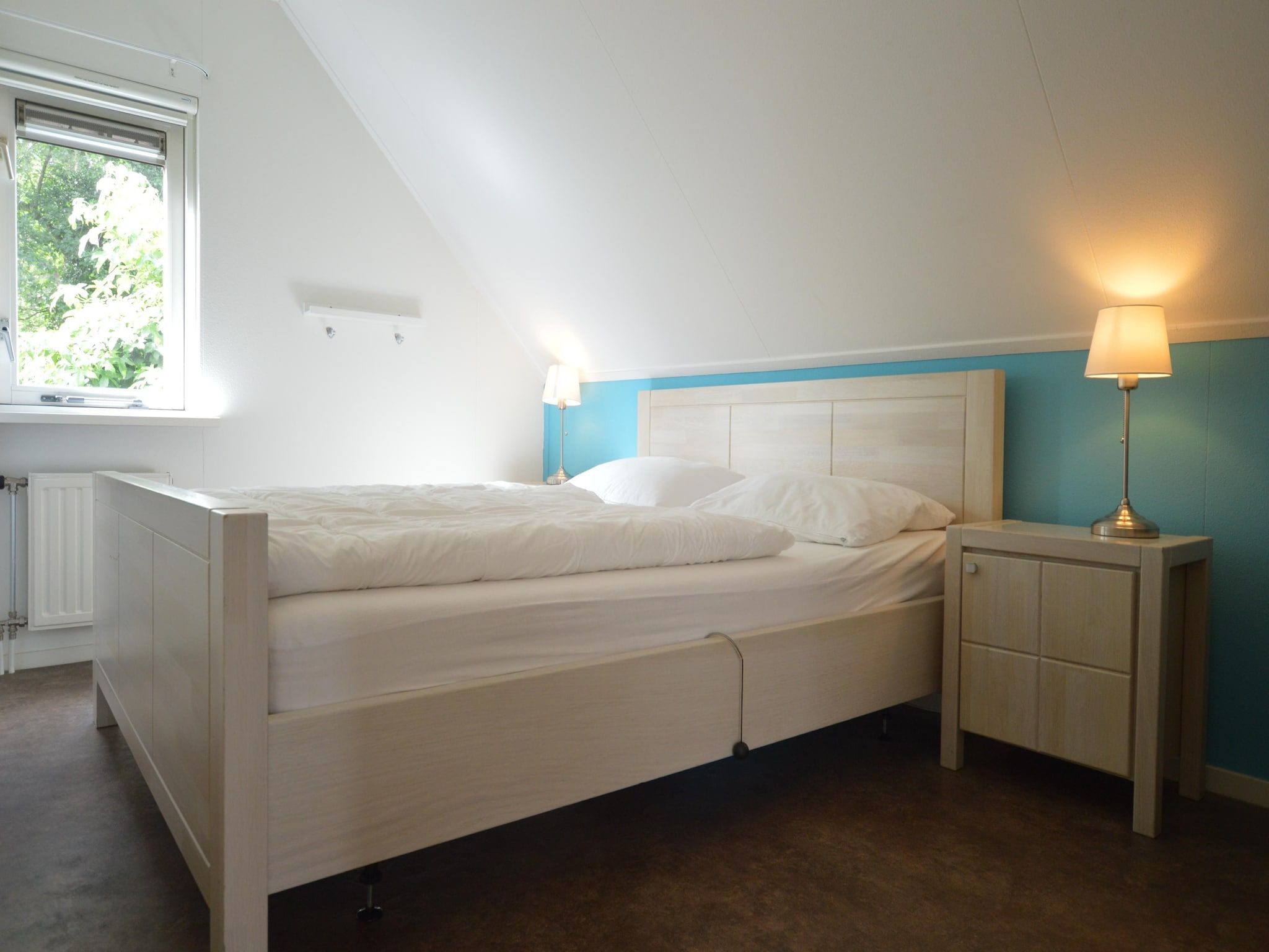 Een slaapkamer van Buitenplaats Berg en Bos nummer 15 in Lemele