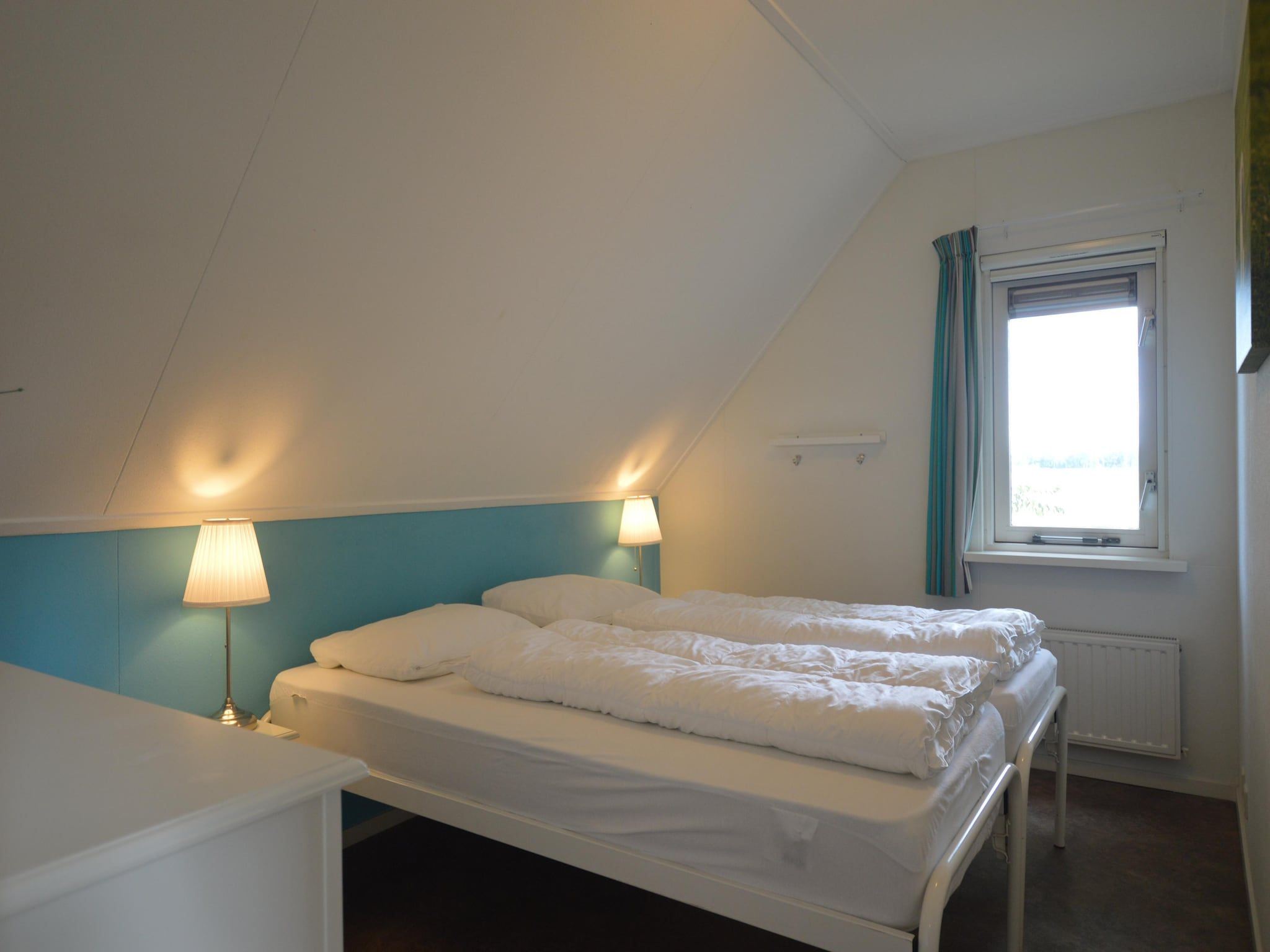 Een slaapkamer van Buitenplaats Berg en Bos nummer 15 in Lemele