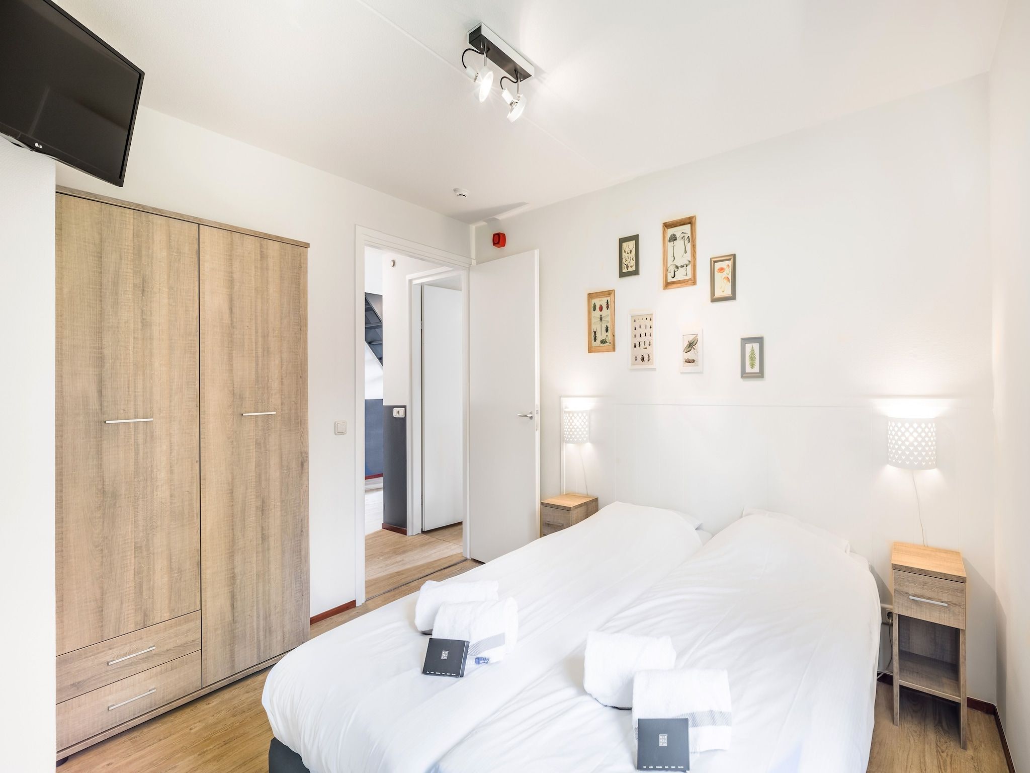 Een slaapkamer van Vakantiepark Weerterbergen 13 in Weert