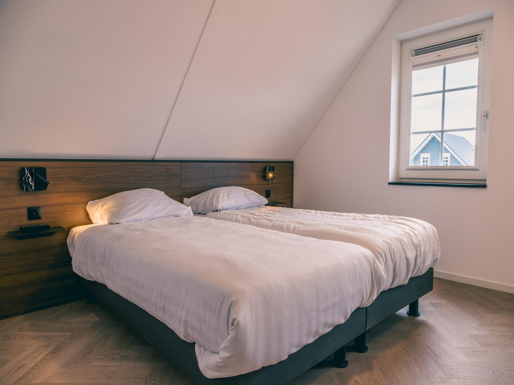 Een slaapkamer van Watervilla Sauna 6 in Medemblik