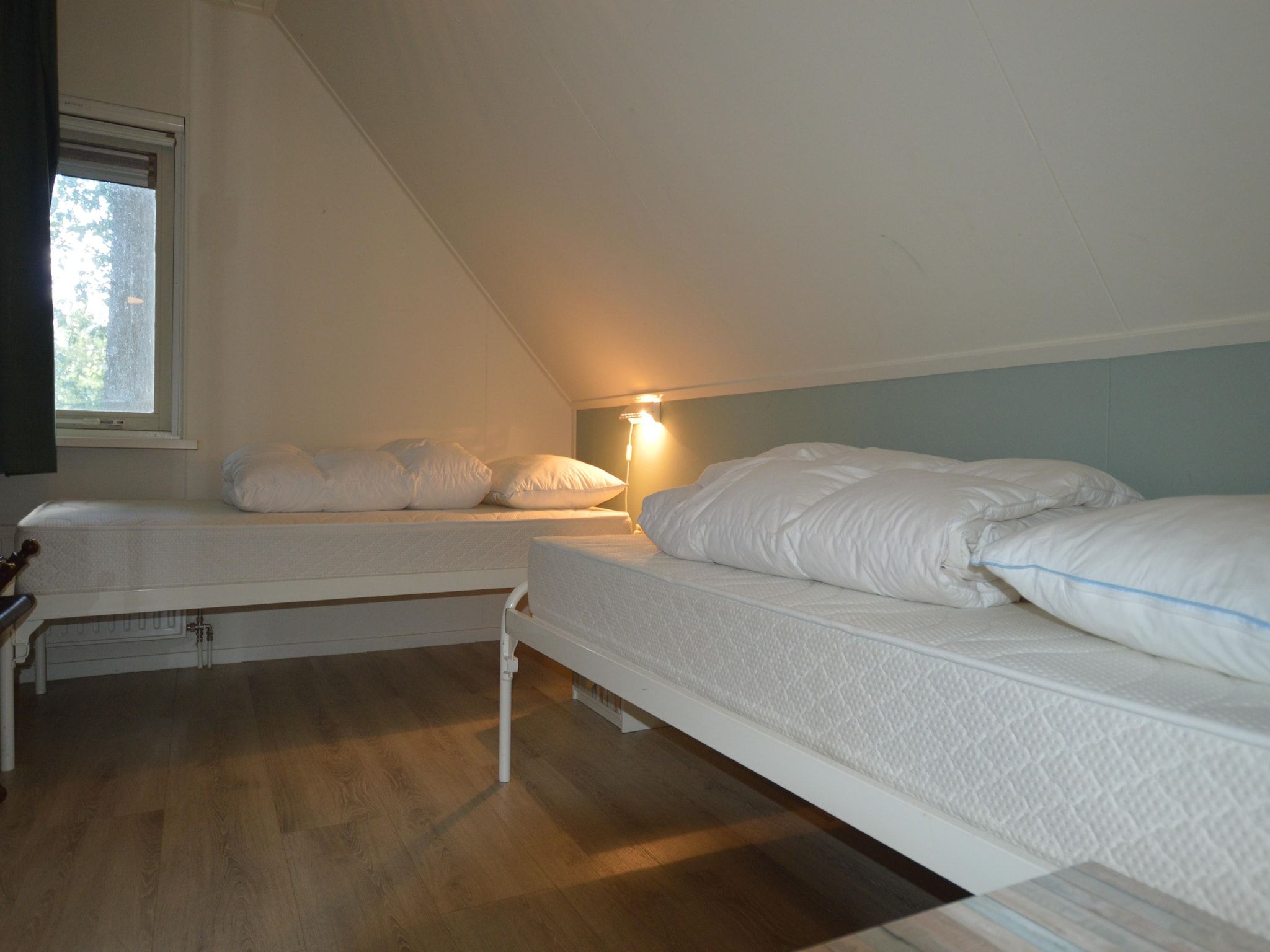 Een slaapkamer van Buitenplaats Berg en Bos nummer 13 in Overijssel