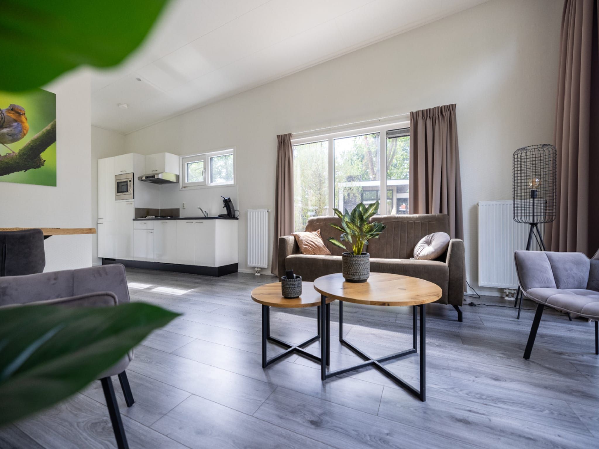 De woonkamer van Vakantiepark De Rimboe & De Woeste Hoogte 27 in Hoenderloo