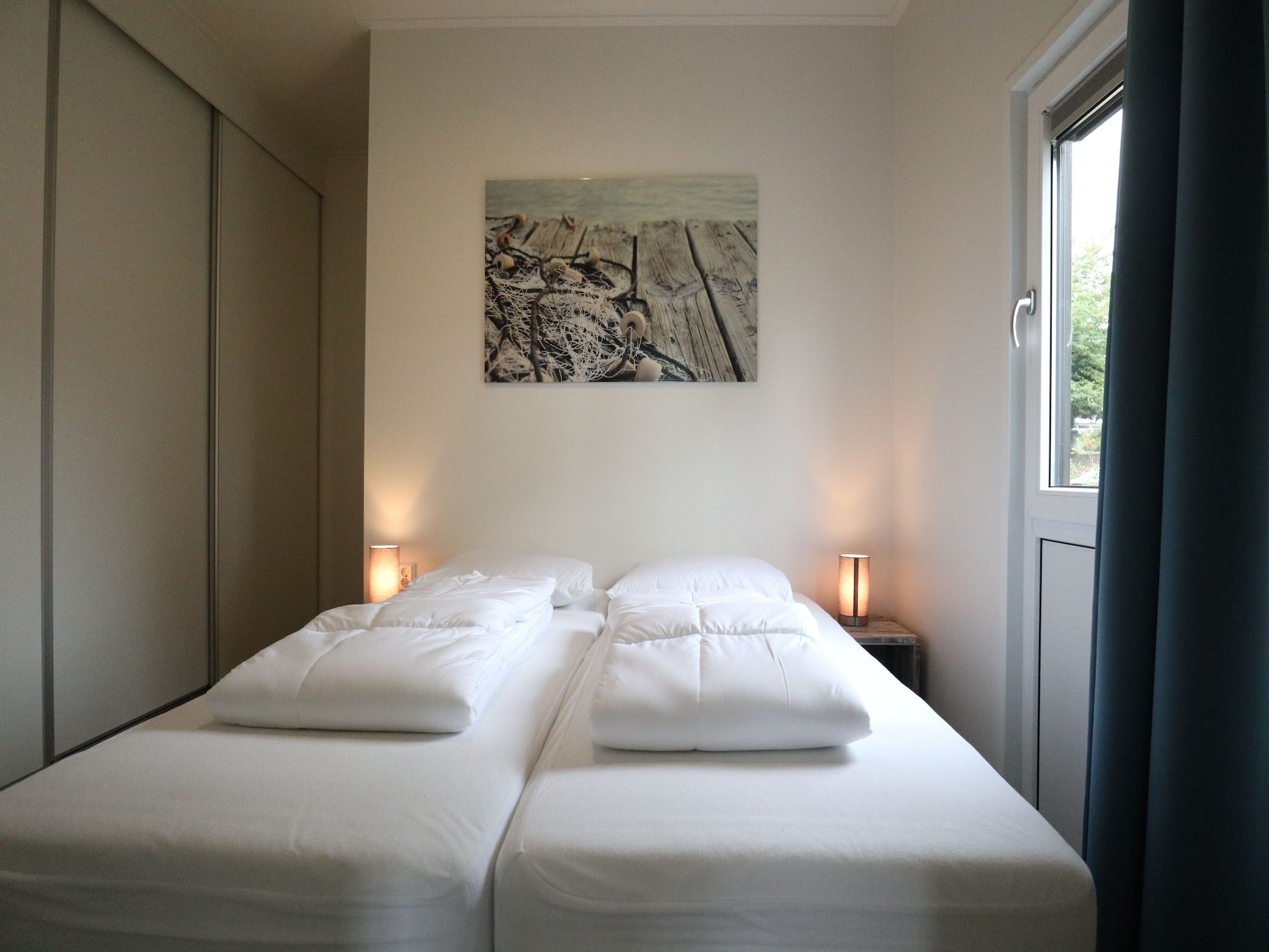 Een slaapkamer van Cube la Mer 4 in Olburgen
