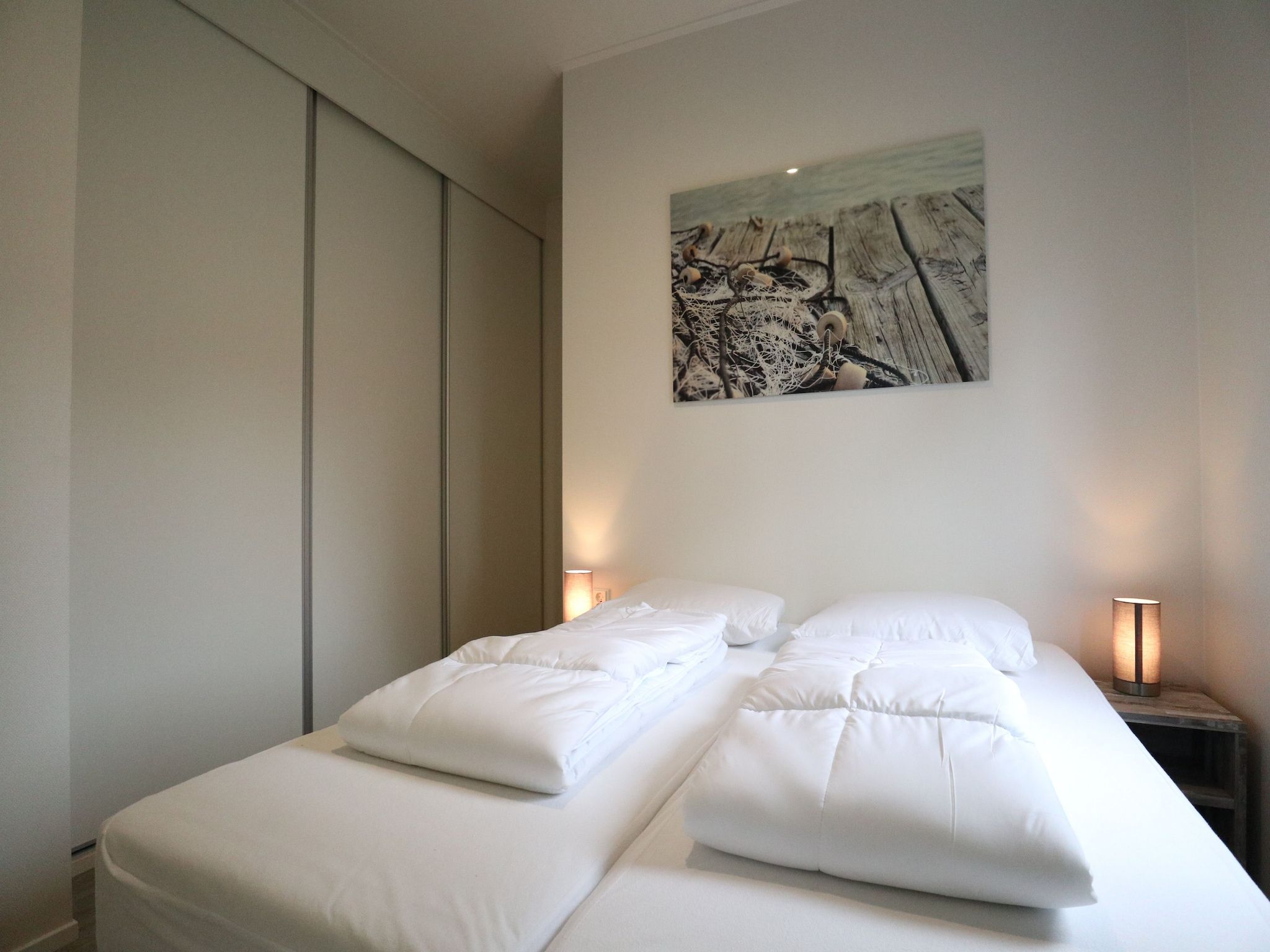 Een slaapkamer van Cube la Mer 4 in Olburgen