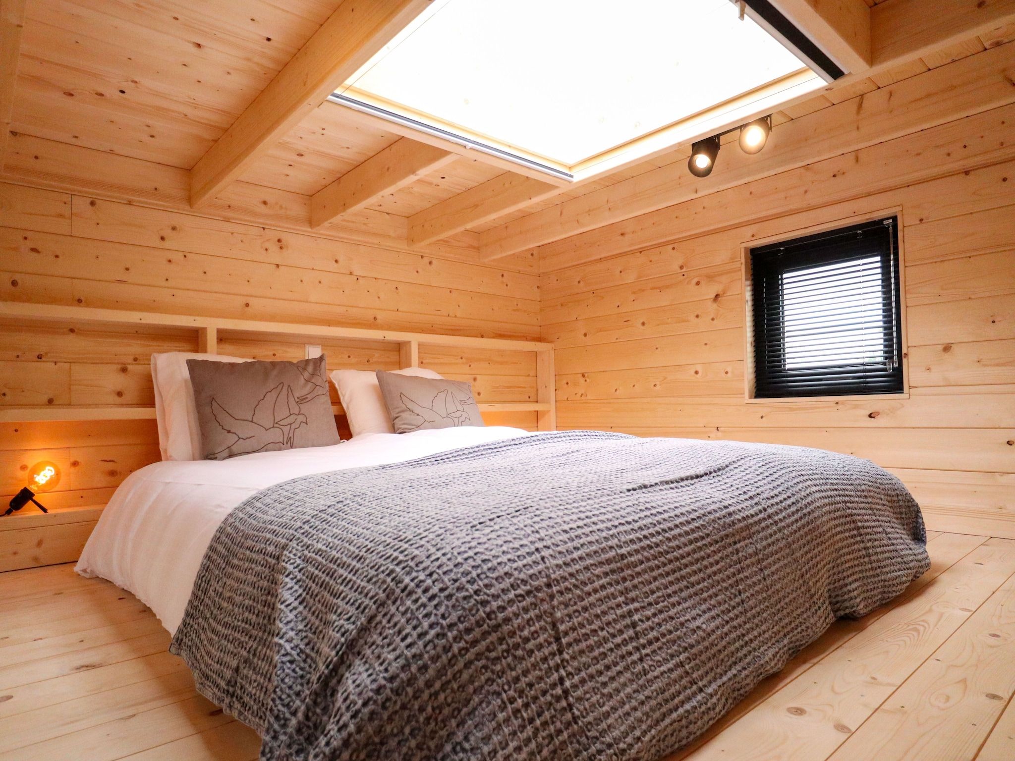 Een slaapkamer van Tiny House 2 in Olburgen