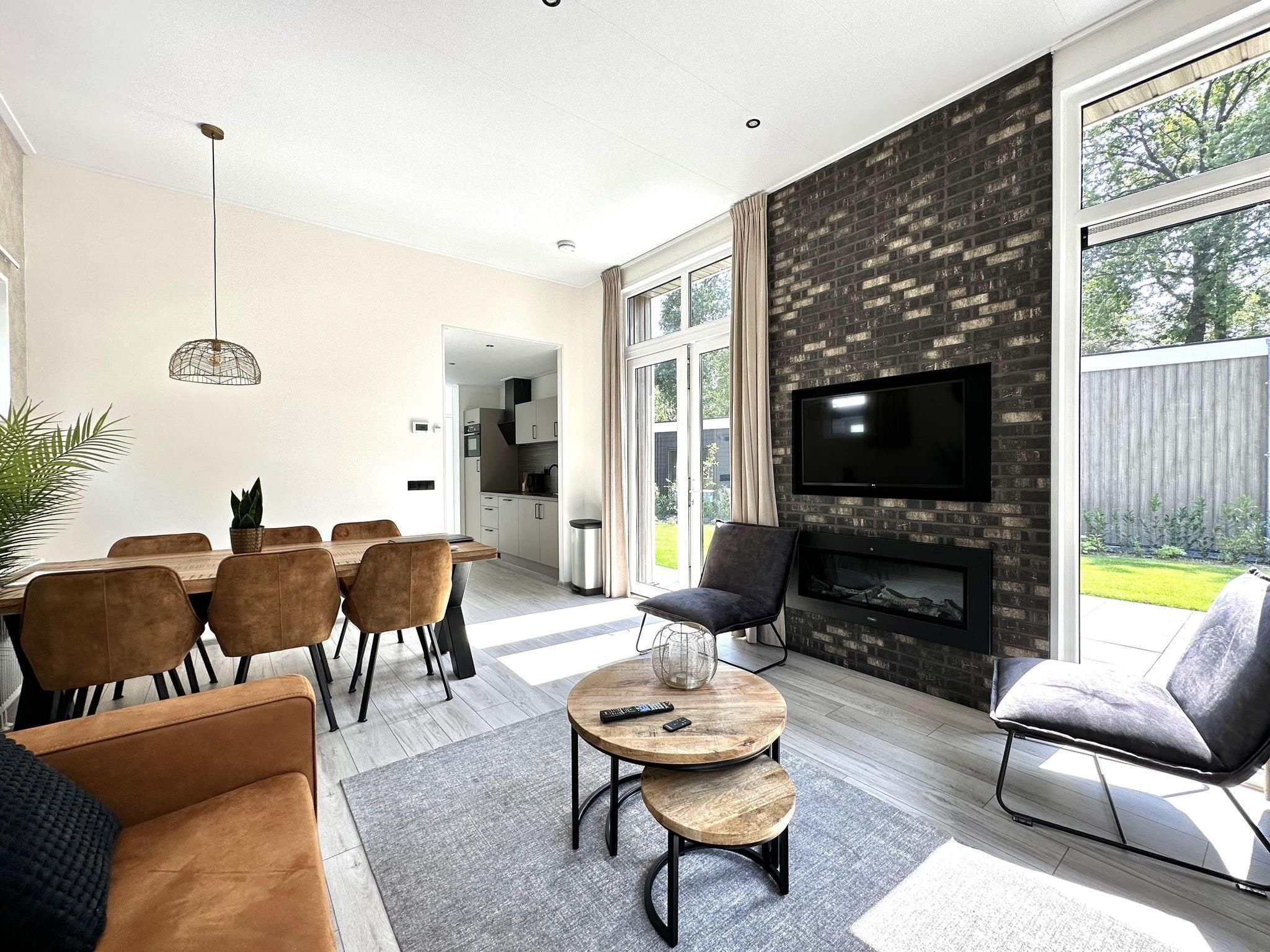 De woonkamer van Vakantiepark De Rimboe & De Woeste Hoogte 28 in Hoenderloo