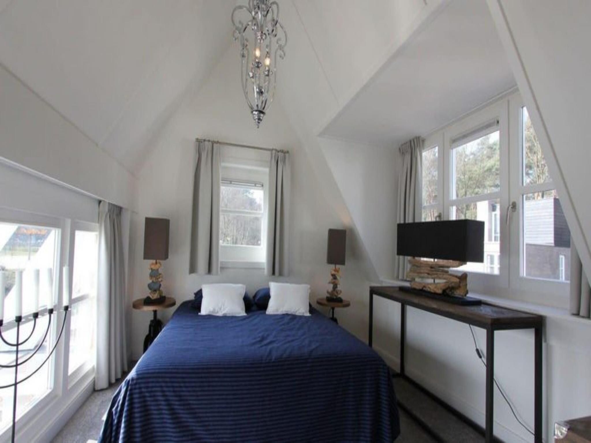 Een slaapkamer van Strandvilla&nbsp;6 in Otterlo