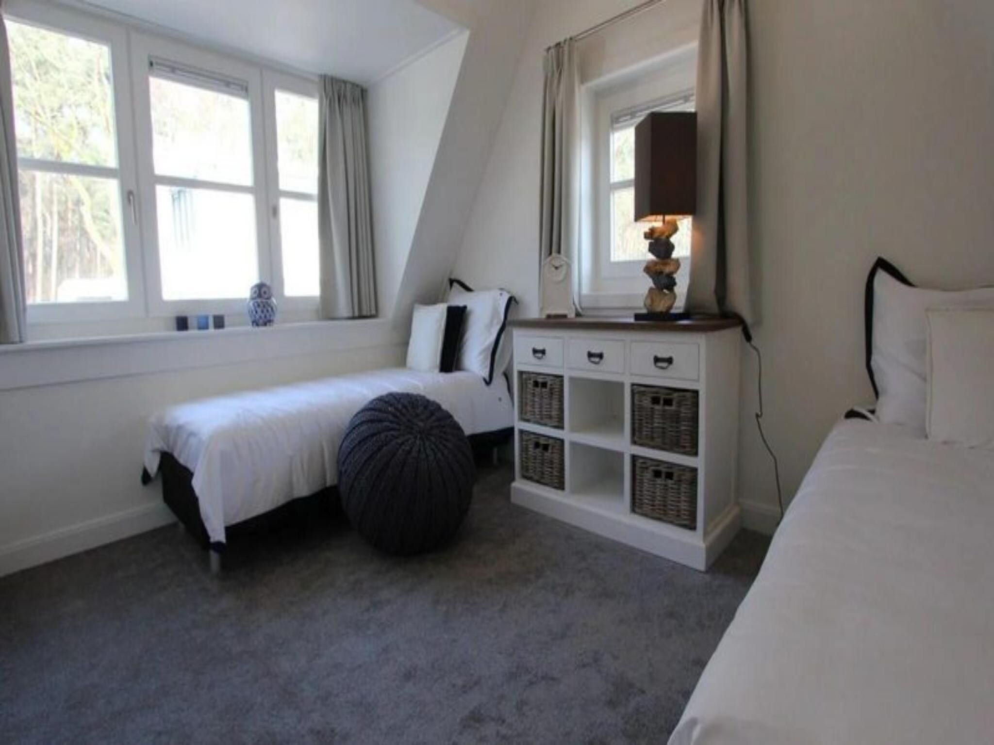 Een slaapkamer van Strandvilla&nbsp;6 in Otterlo