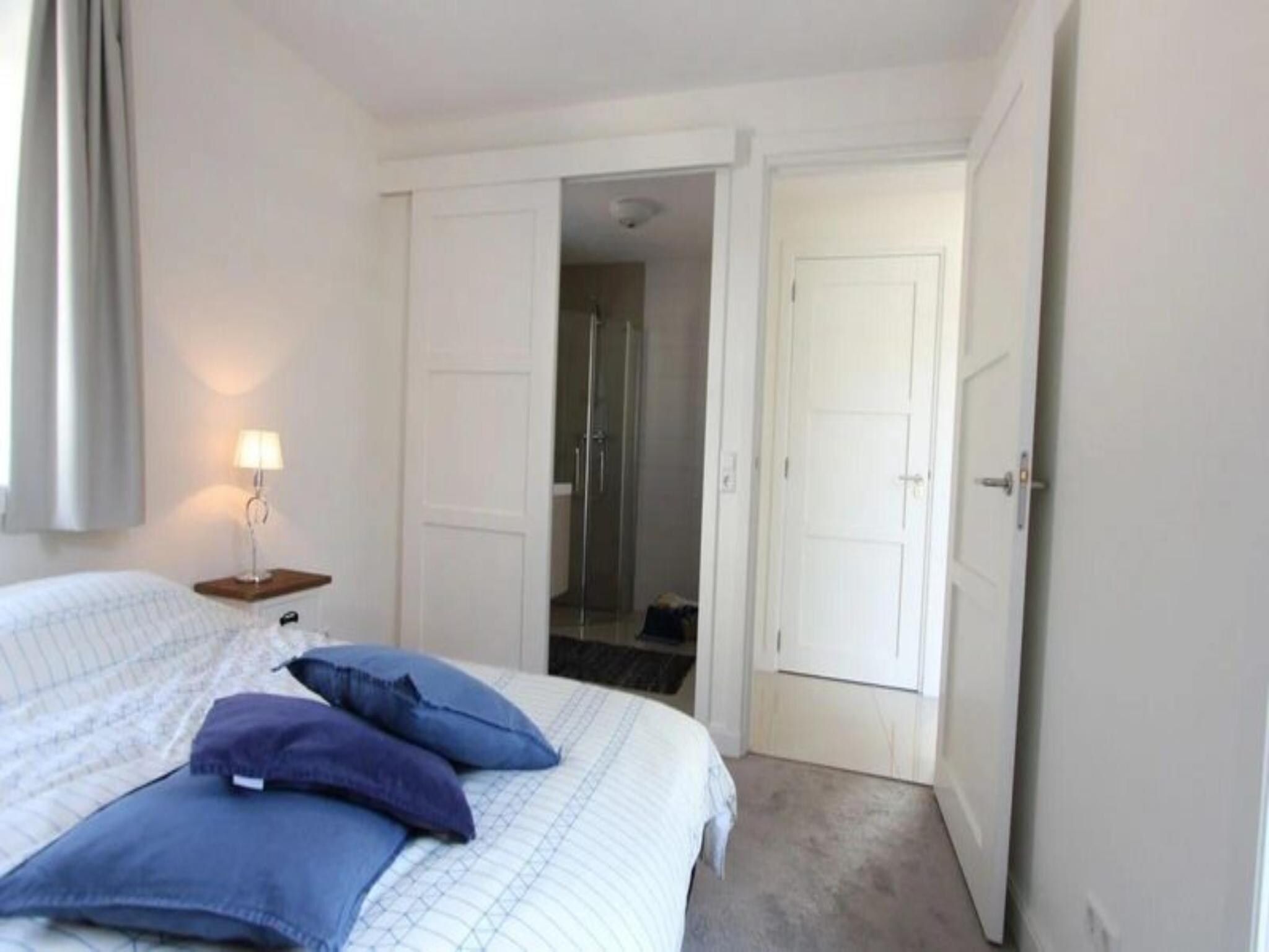 Een slaapkamer van Strandvilla&nbsp;6 in Otterlo