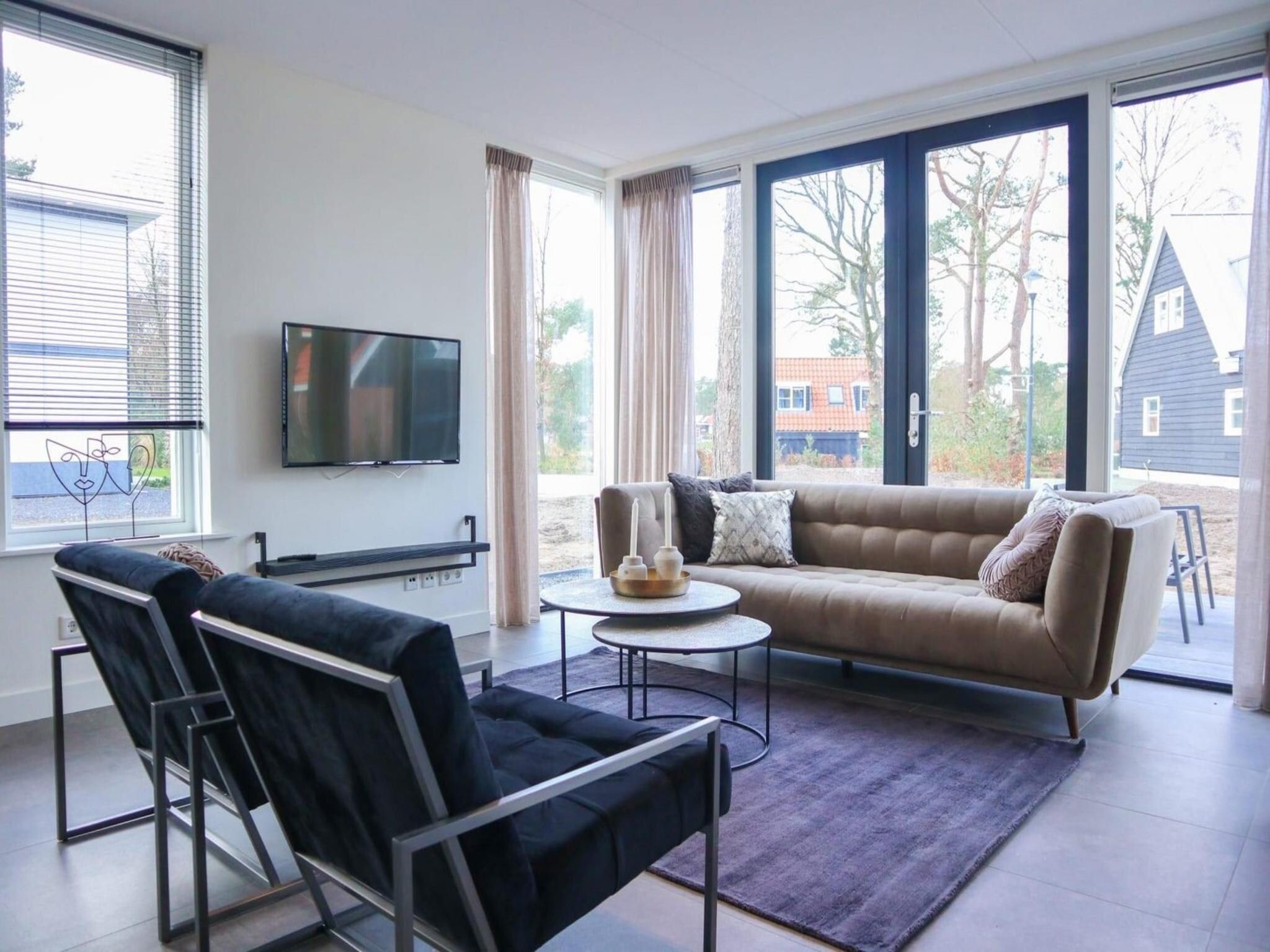 De woonkamer van Villa Wellness 4 in Otterlo