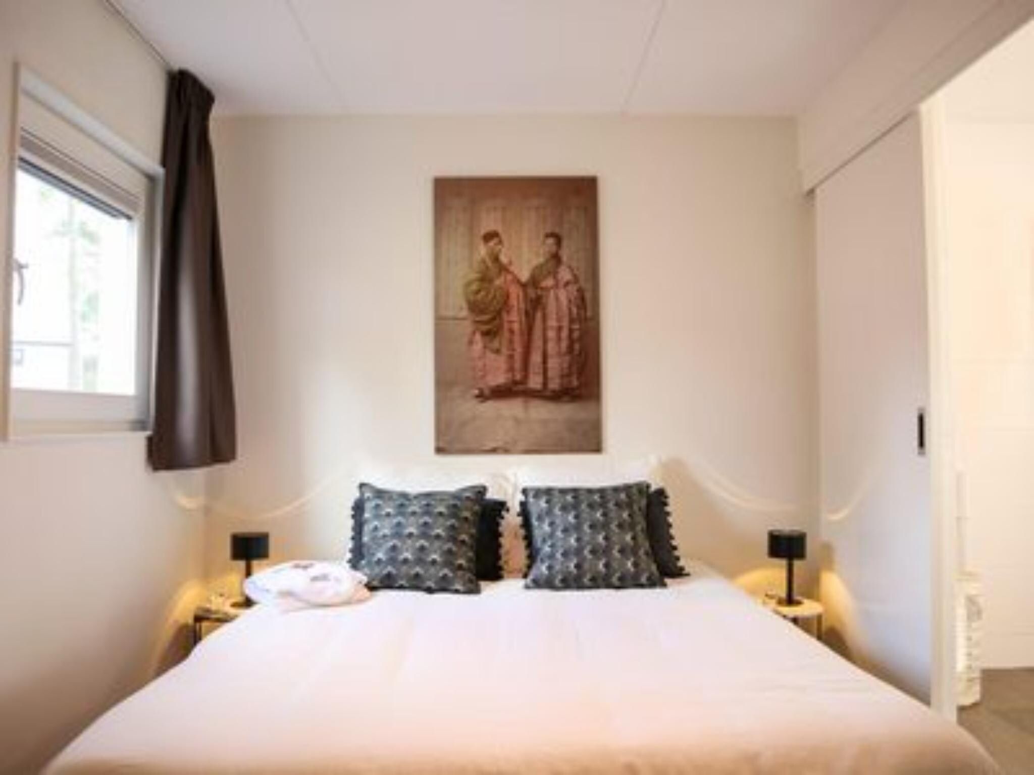 Een slaapkamer van Villa Wellness 4 in Otterlo