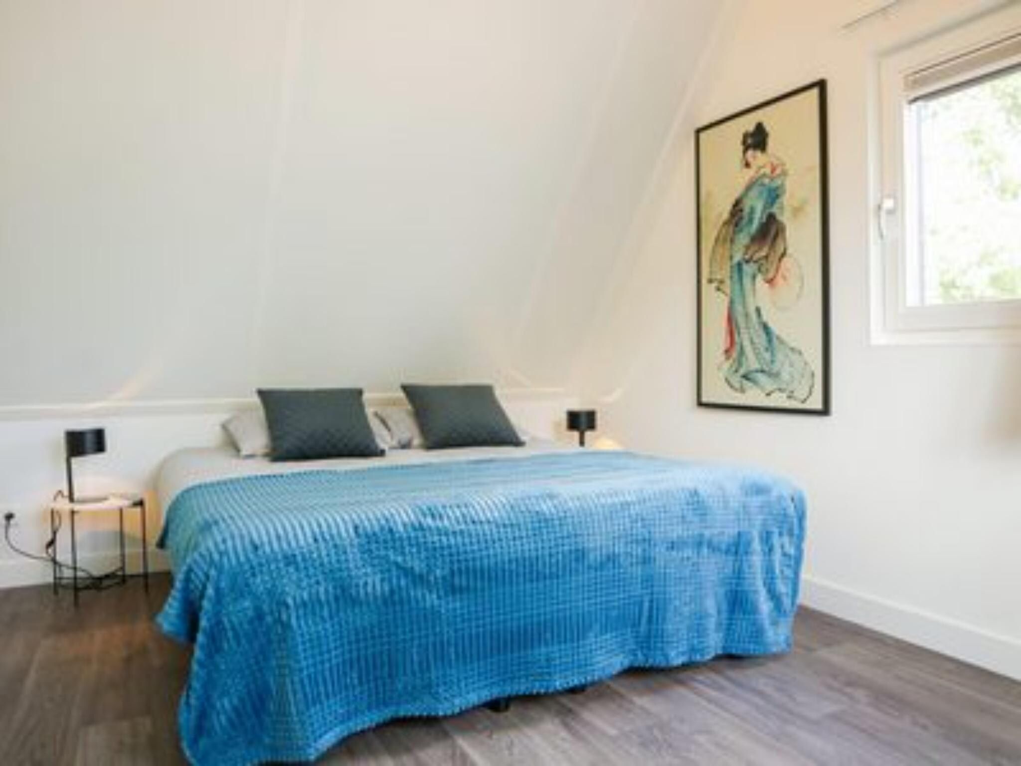 Een slaapkamer van Villa Wellness 4 in Otterlo