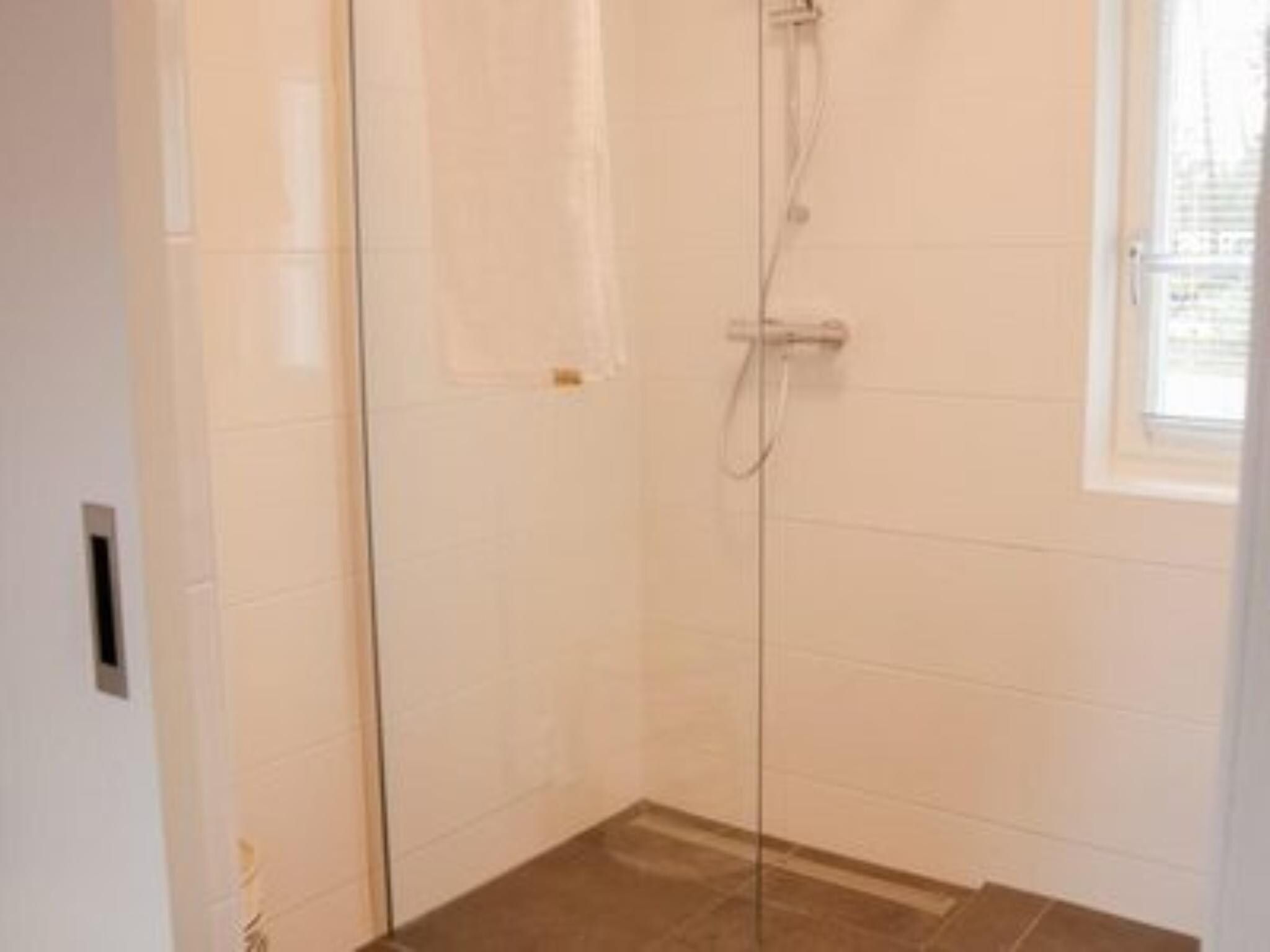 De badkamer van Villa Wellness 4 in Otterlo