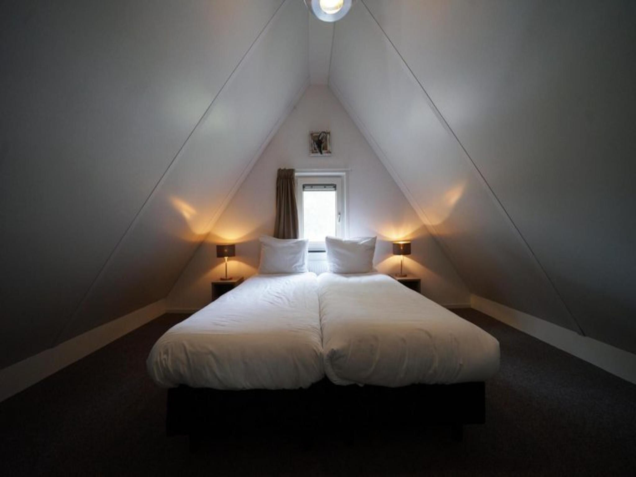 Een slaapkamer van Geheim van Otterlo 8 in Otterlo