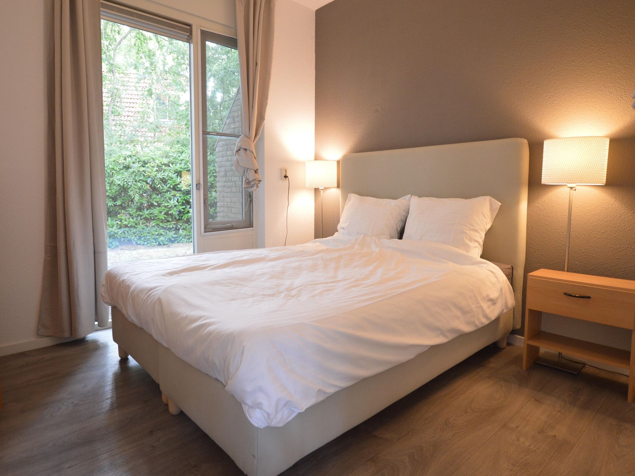 Een slaapkamer van Buitenplaats Berg en Bos nummer 4 in Lemele