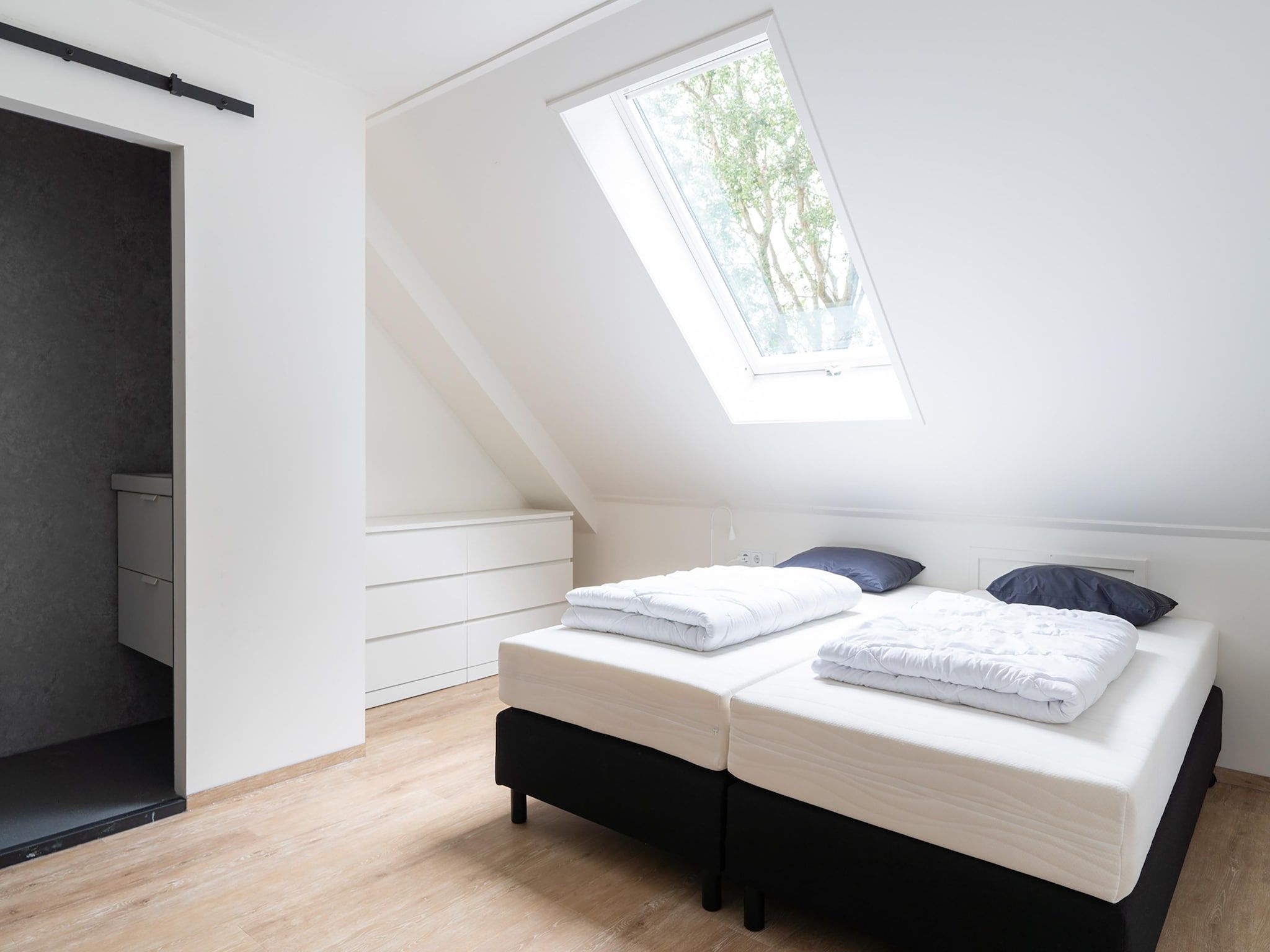 Een slaapkamer van Vrijersduin in Nes