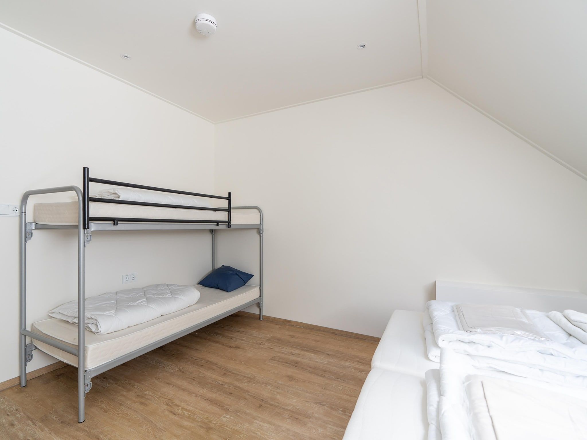 Een slaapkamer van Kaapsduin in Nes