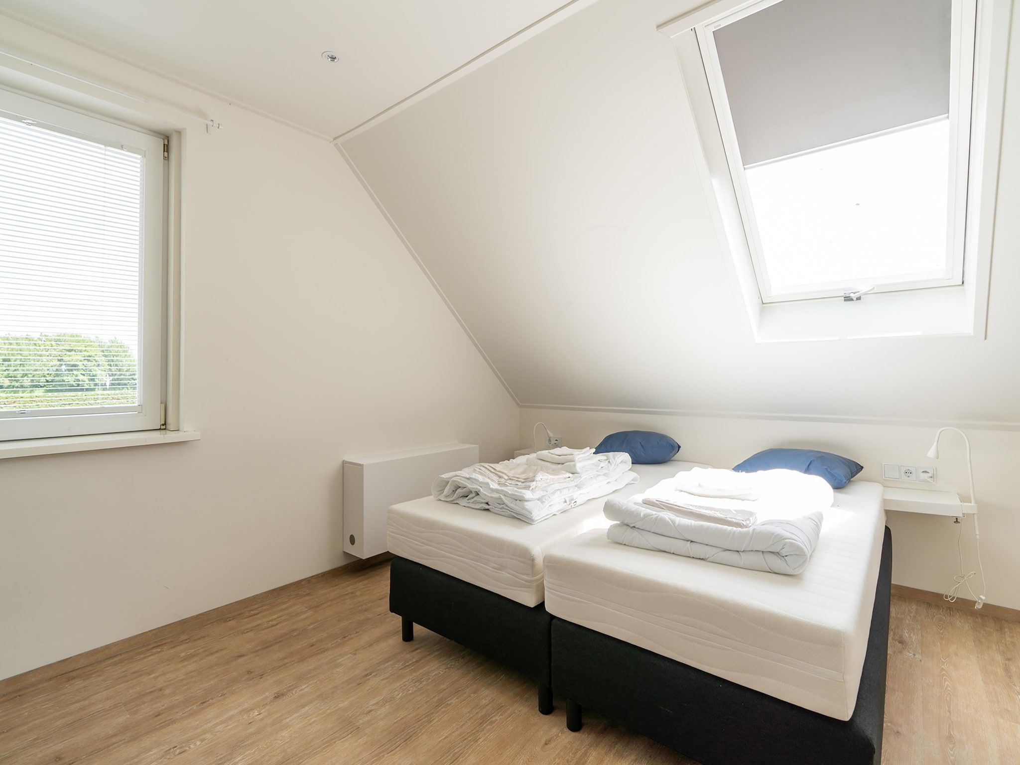 Een slaapkamer van Kaapsduin in Nes