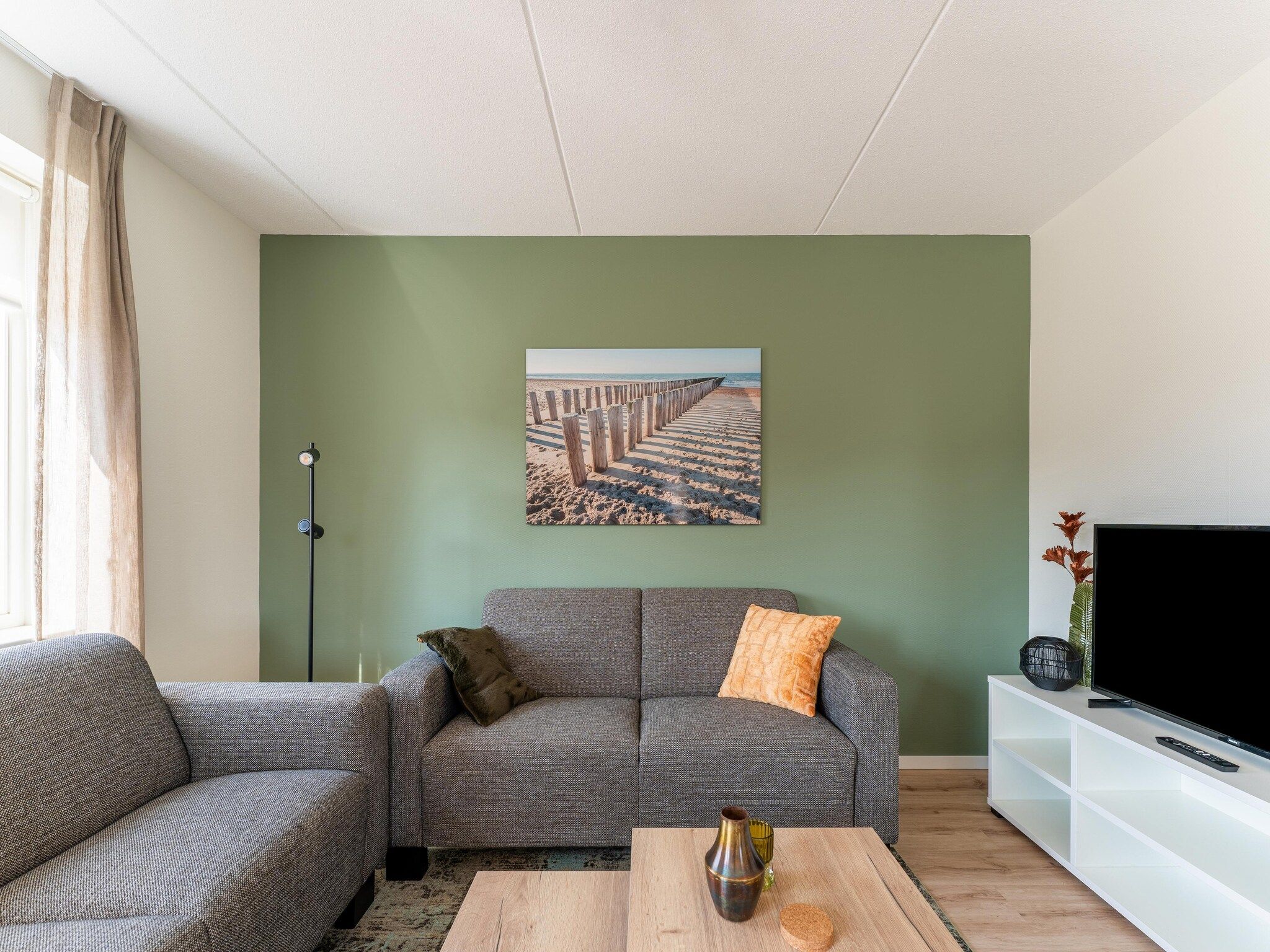 De woonkamer van De Tjiftjaf Huis Nr 21 in Scherpenisse