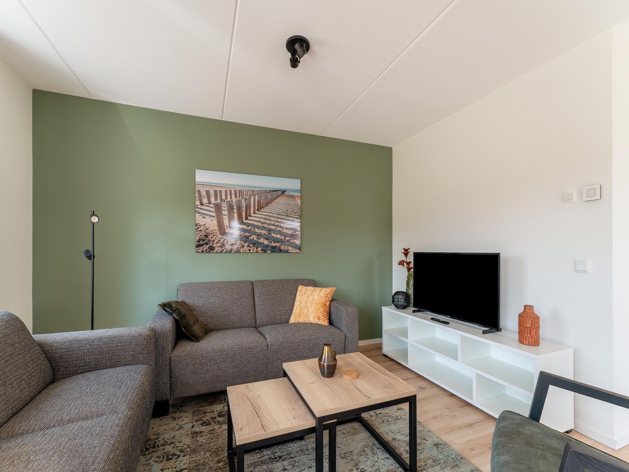 De woonkamer van De Tjiftjaf Huis Nr 21 in Scherpenisse