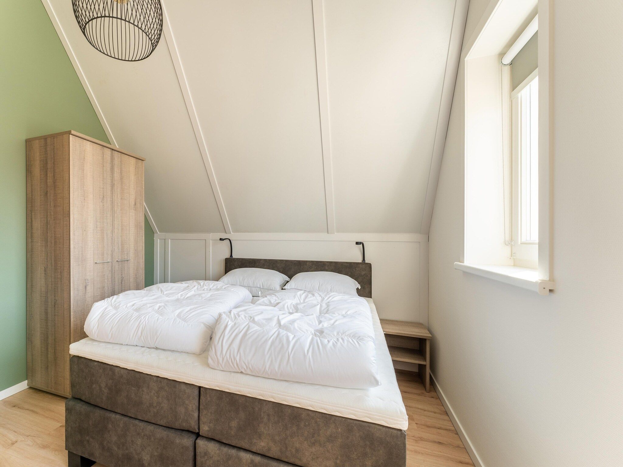 Een slaapkamer van De Tjiftjaf Huis Nr 21 in Scherpenisse
