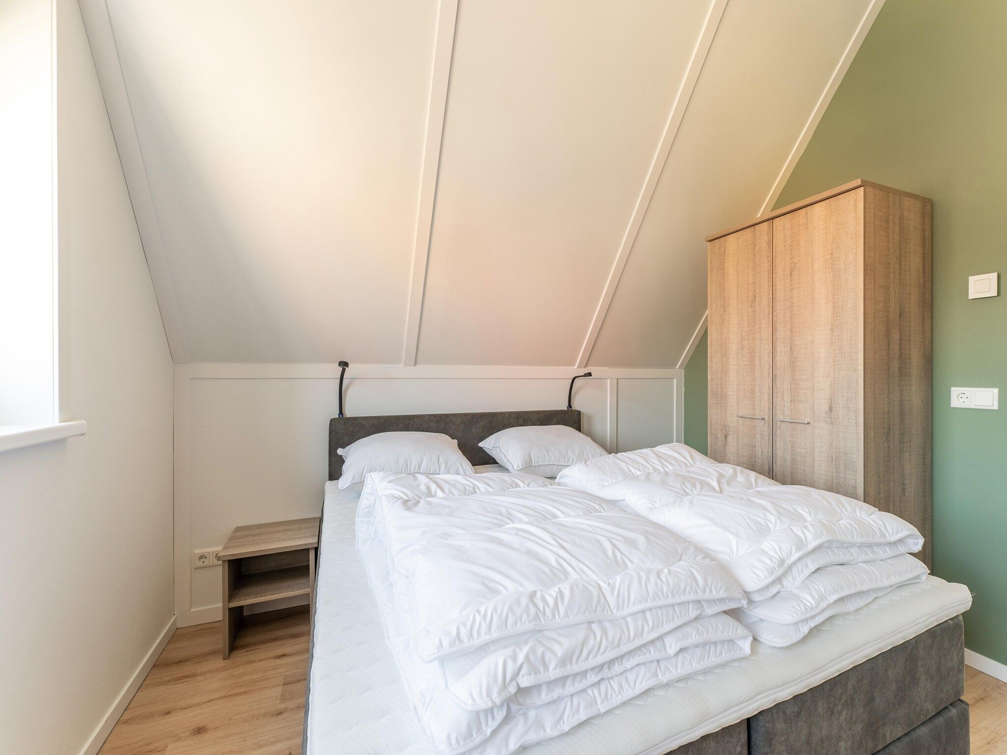 Een slaapkamer van De Tjiftjaf Huis Nr 21 in Scherpenisse