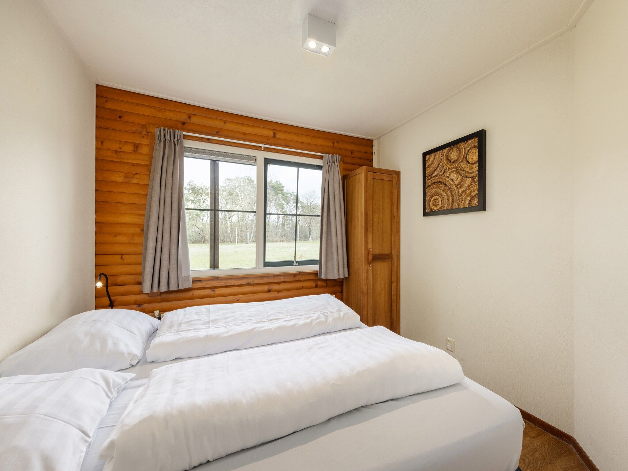 Een slaapkamer van De Veluwse Hoevegaerde 7 in Putten