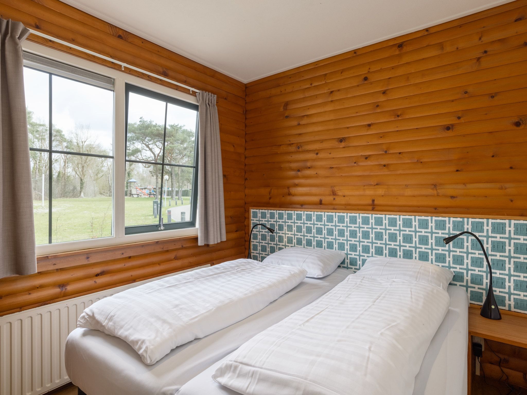 Een slaapkamer van De Veluwse Hoevegaerde 7 in Putten