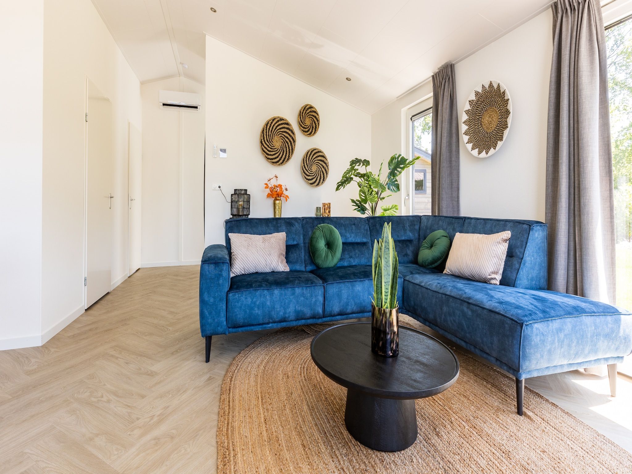 De woonkamer van Vakantiepark Molenvelden 3 in Veldhoven