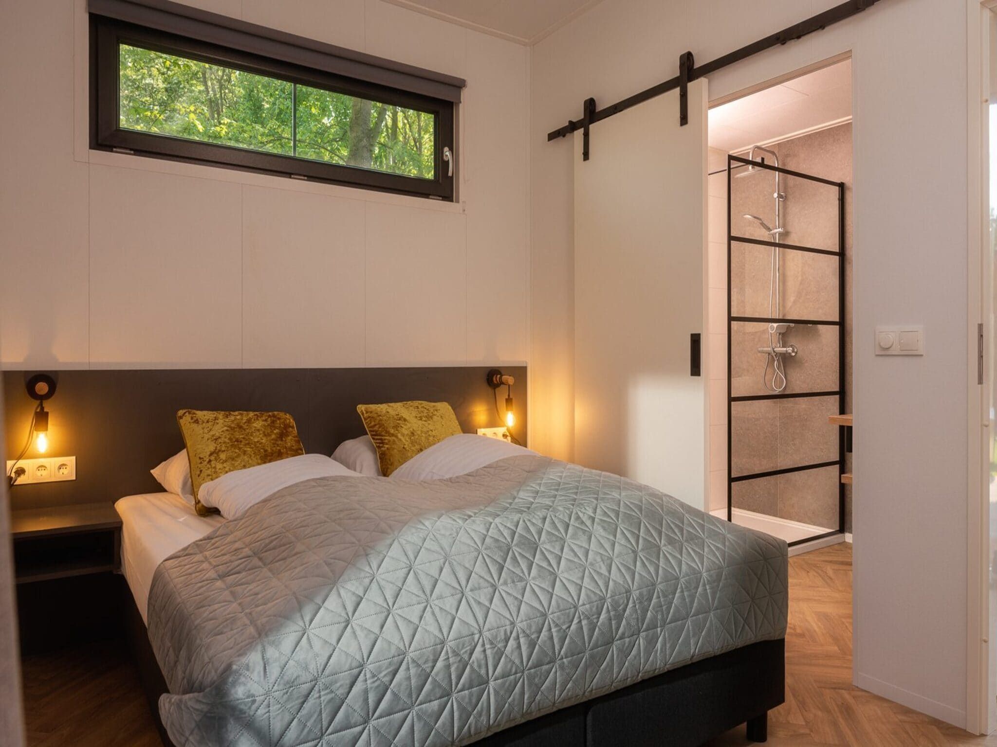 Een slaapkamer van Vakantiepark Mölke 35 in Zuna