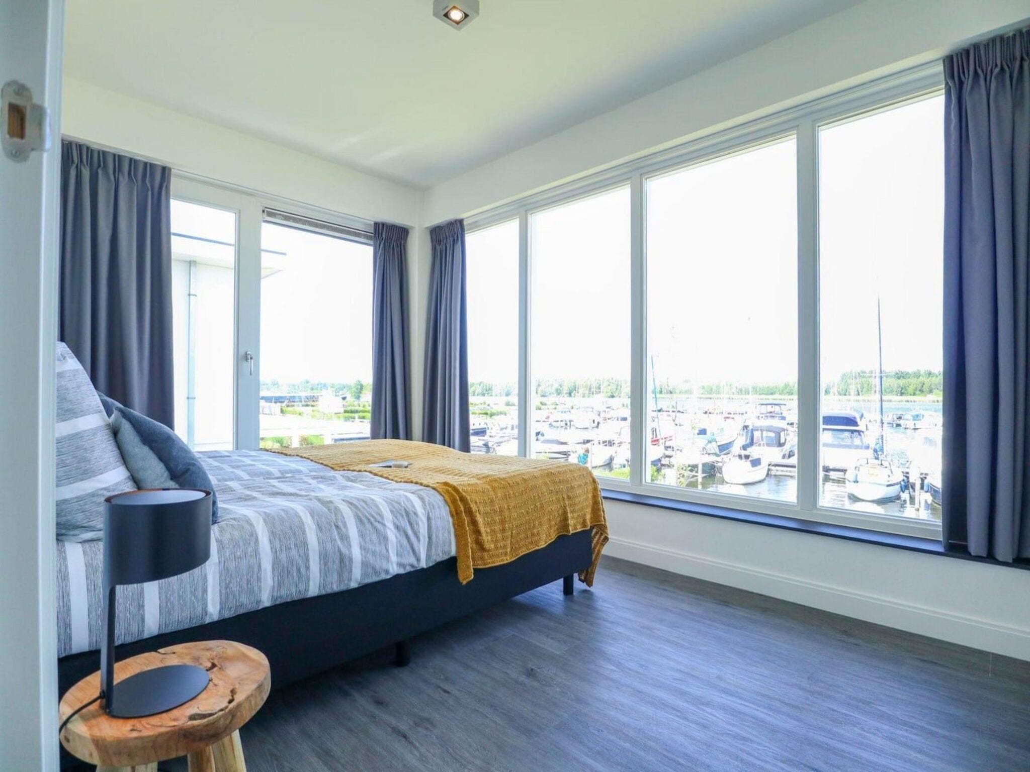 Een slaapkamer van Villa Meerzicht 8 in Nijkerk