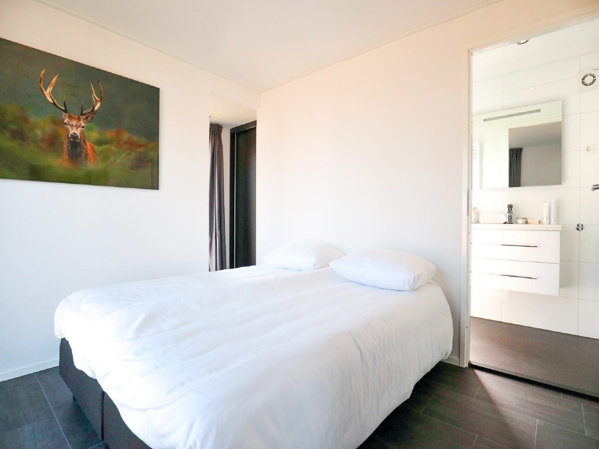 Een slaapkamer van Cube Exclusif 4 in Breskens