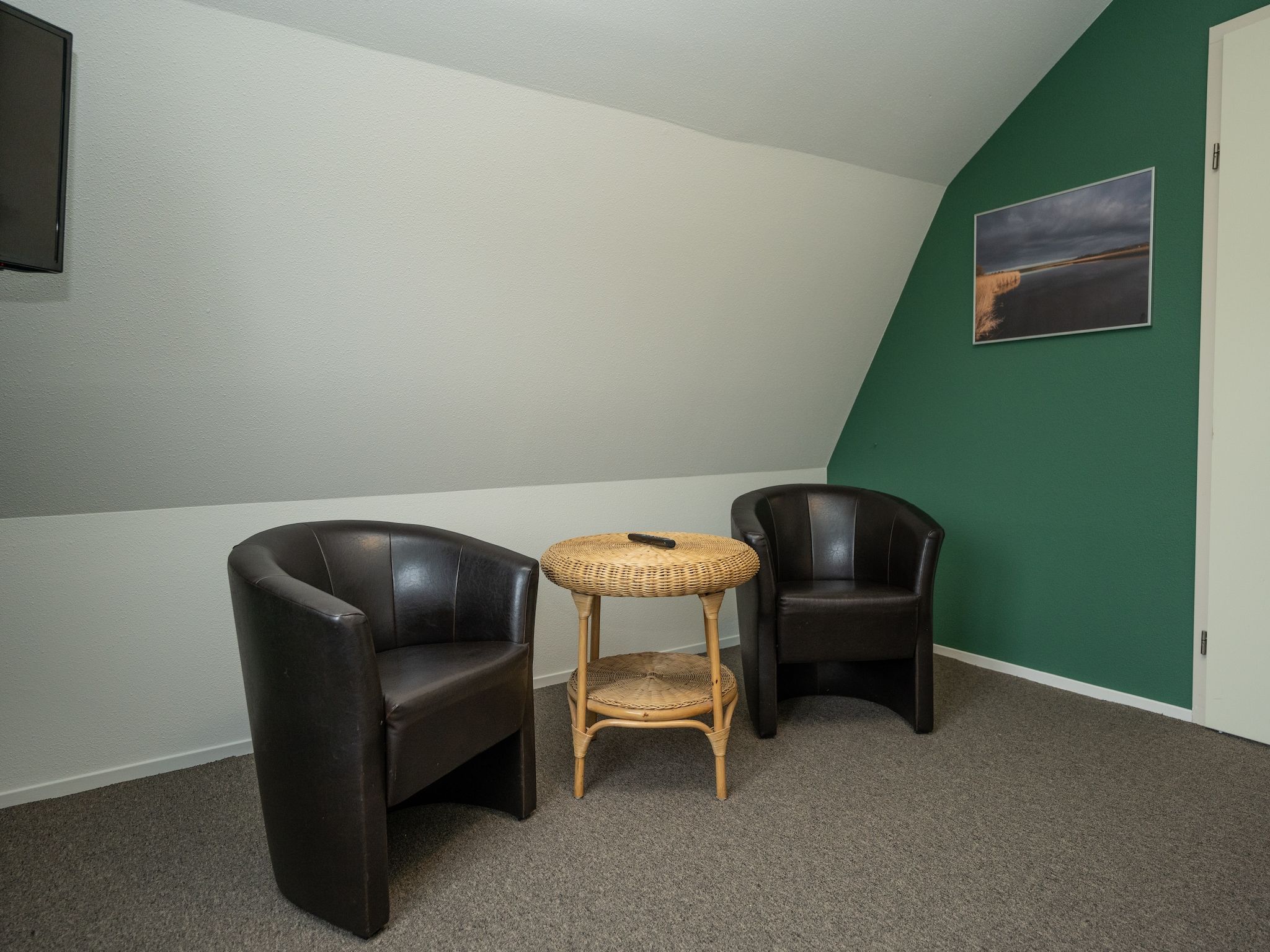 Een slaapkamer van Vakantiepark 't Eibernest Texel 7 in De Cocksdorp