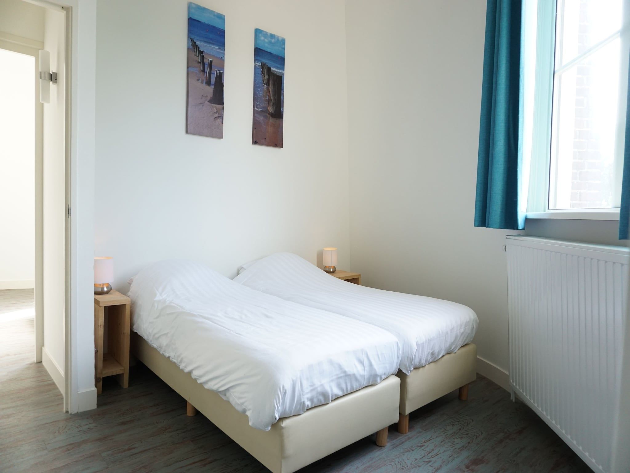 Een slaapkamer van Familiehuis Watertoren 8 pers in Vlissingen