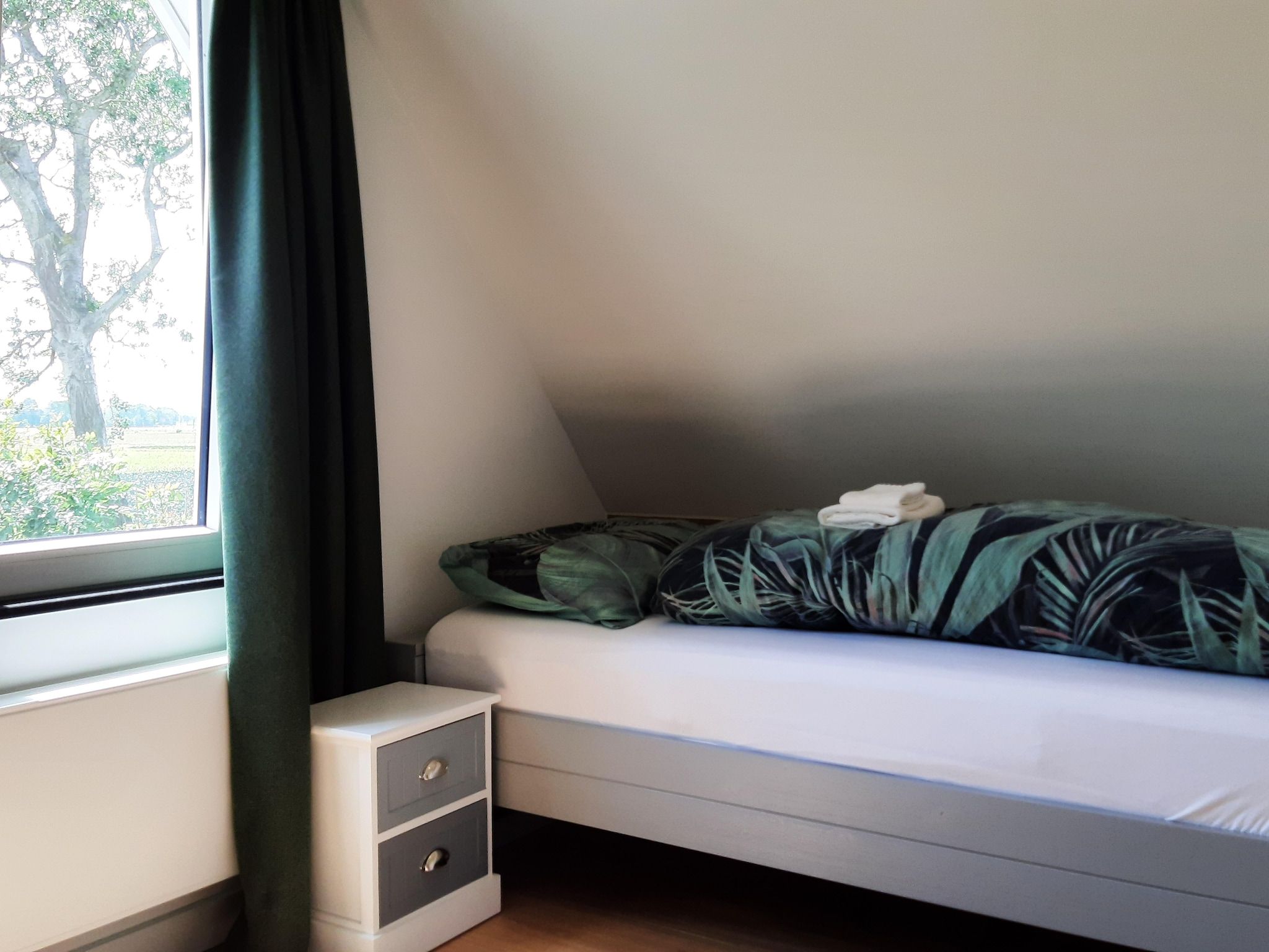 Een slaapkamer van Vakantiehuis DJEZ in Tuitjenhorn