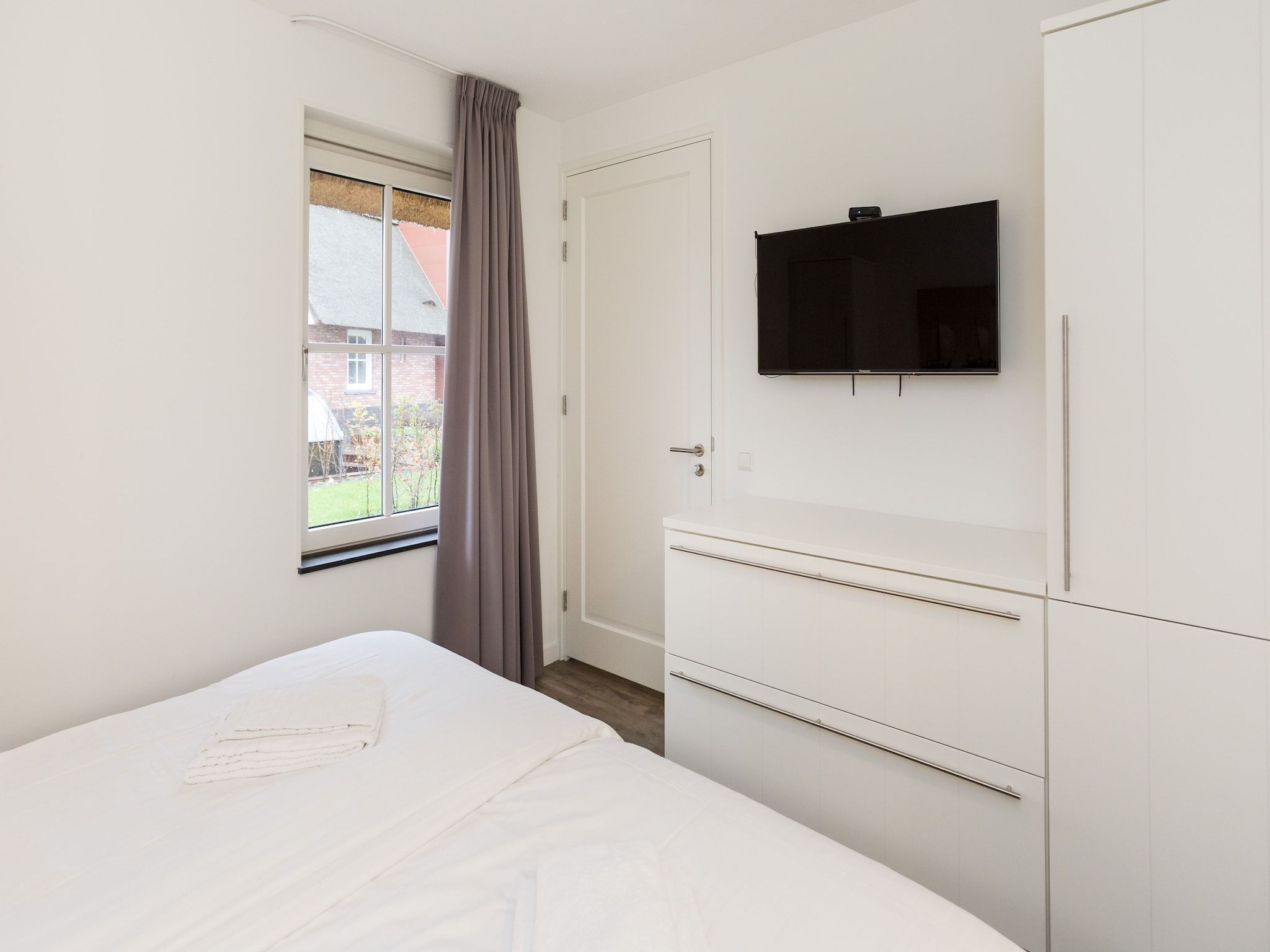 Een slaapkamer van Friese Meren Villa's 17 in Delfstrahuizen