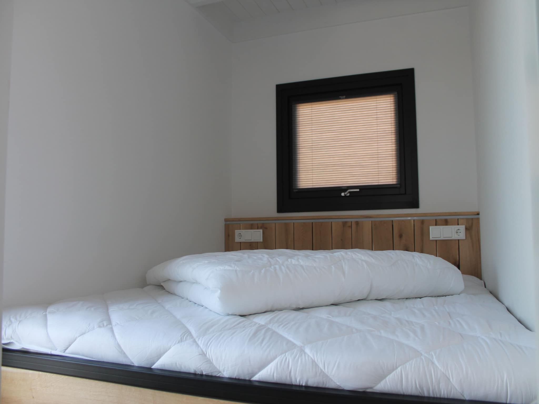 Een slaapkamer van Boat House Stavoren in Stavoren