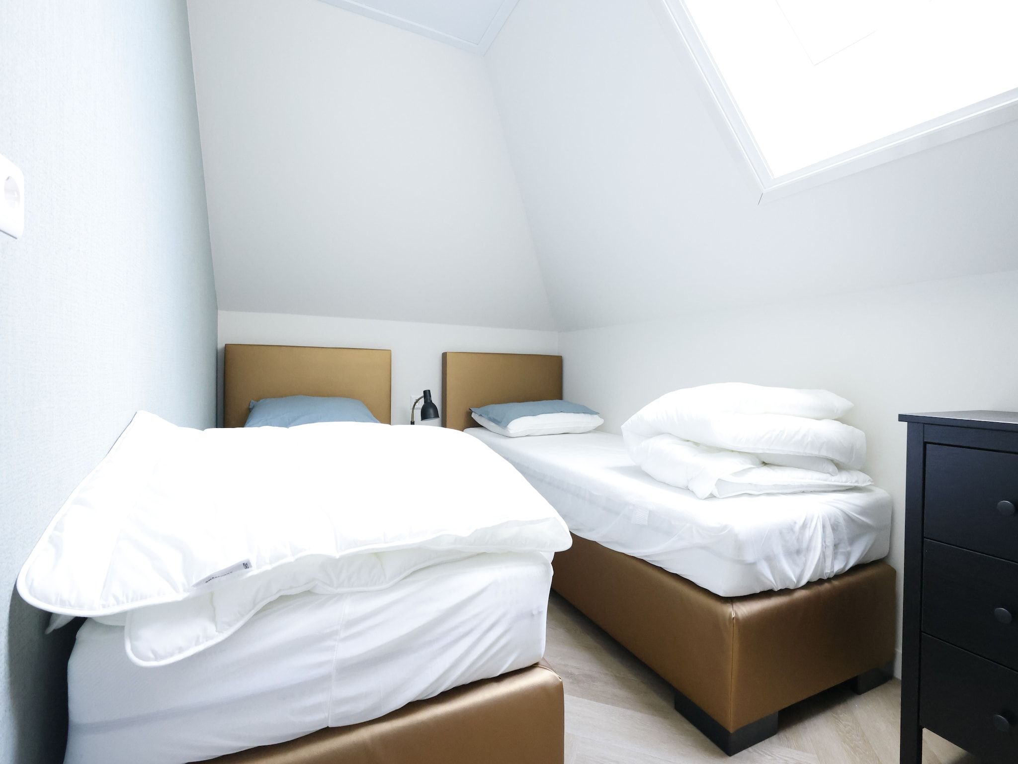 Een slaapkamer van Recreatiepark Wiringherlant - Wiringher Villa 23 in Hippolytushoef