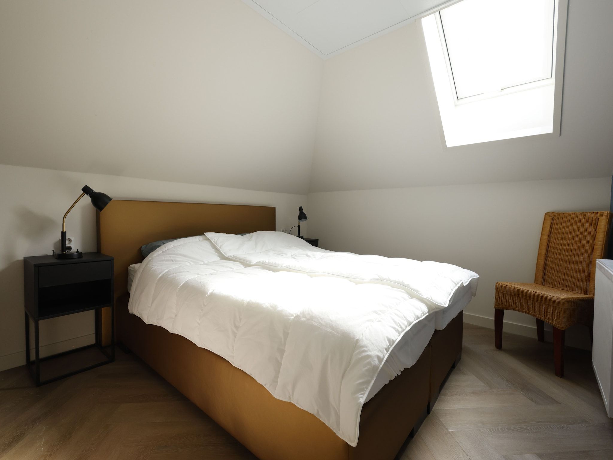 Een slaapkamer van Recreatiepark Wiringherlant - Wiringher Villa 23 in Hippolytushoef