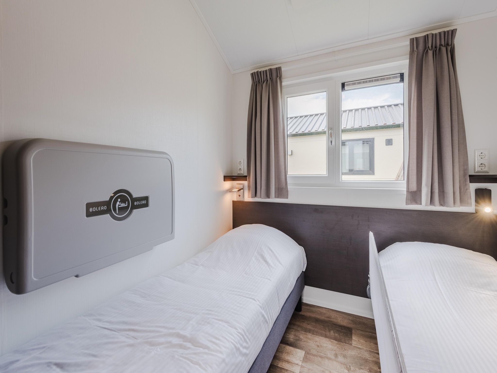 Een slaapkamer van Vakantiepark Giethoorn 8 in Giethoorn