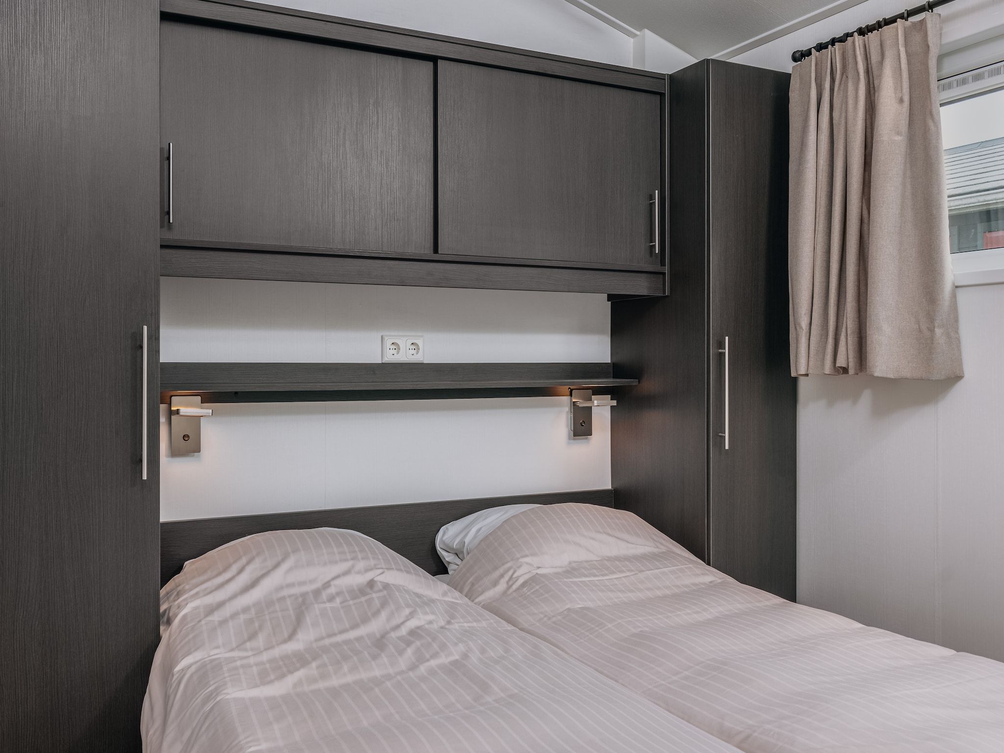 Een slaapkamer van Vakantiepark Giethoorn 10 in Giethoorn