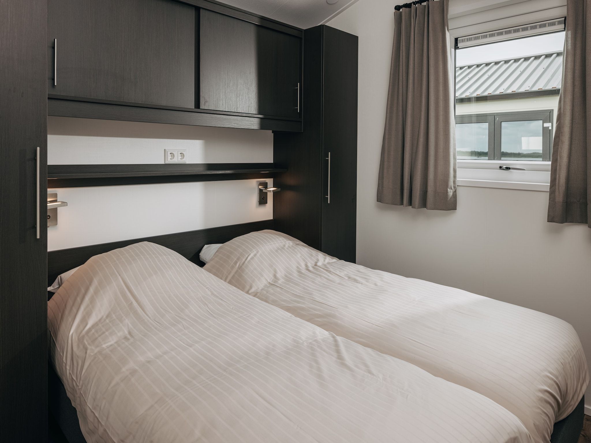 Een slaapkamer van Vakantiepark Giethoorn 11 in Giethoorn