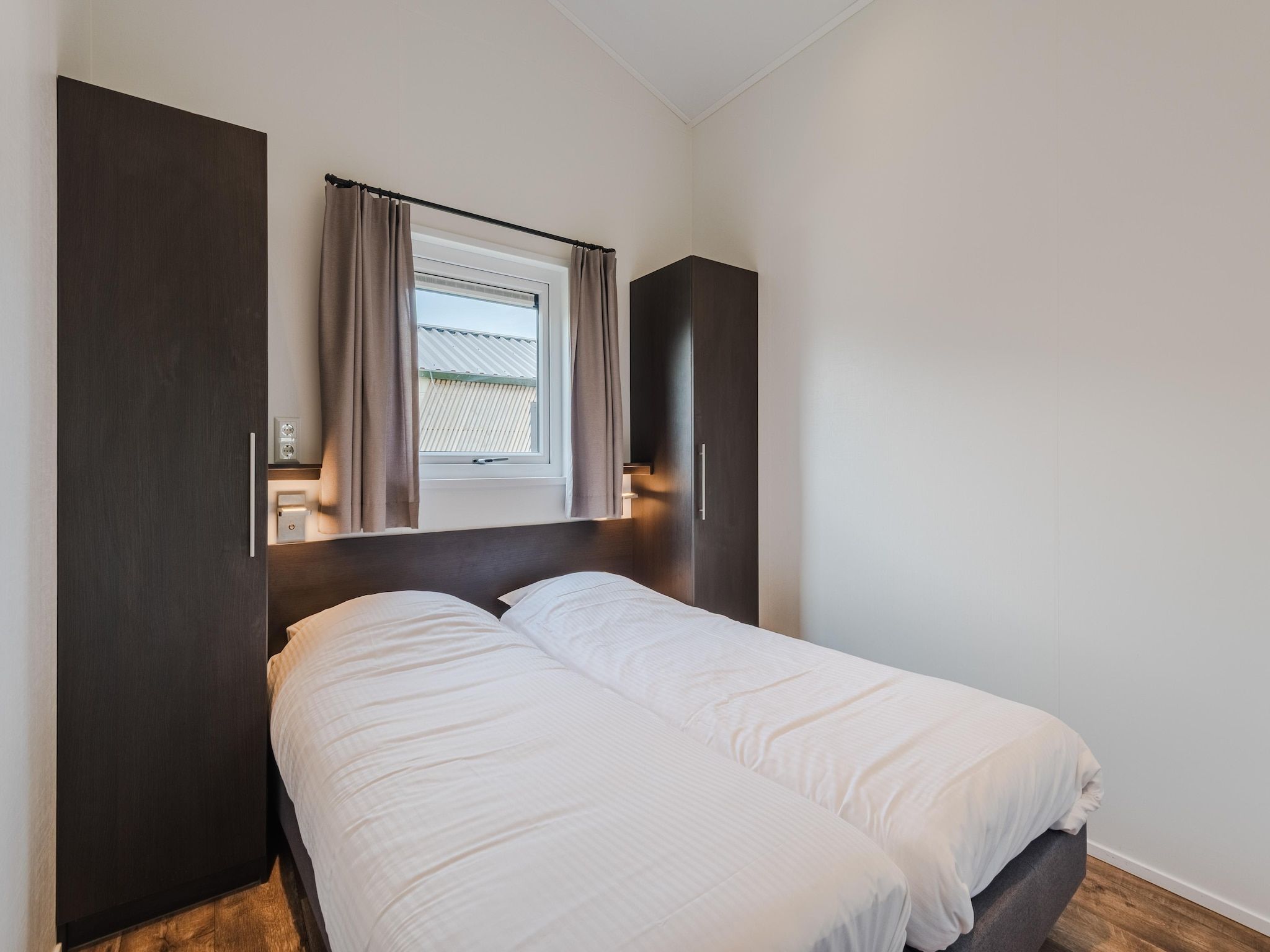 Een slaapkamer van Vakantiepark Giethoorn 11 in Giethoorn