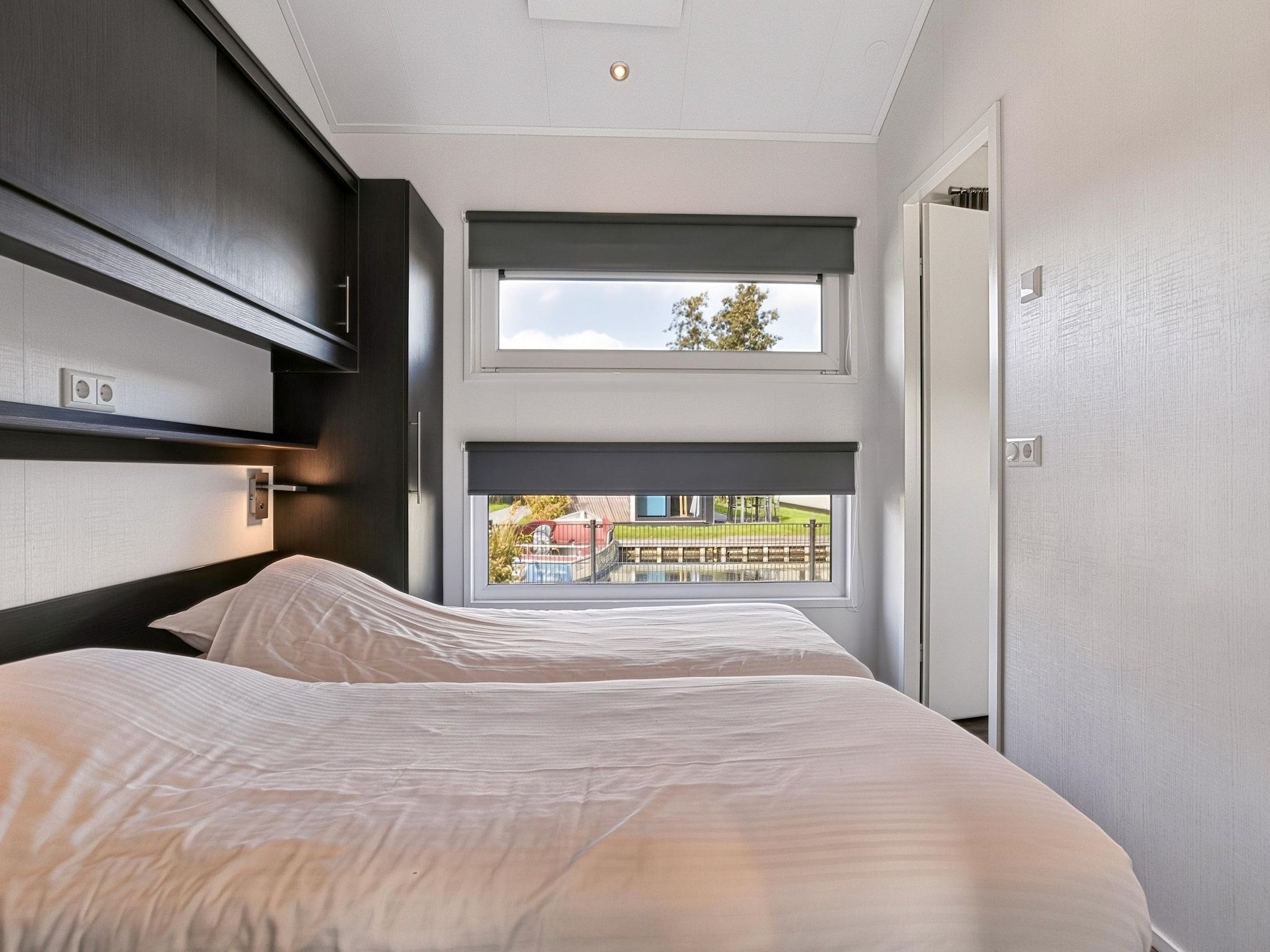 Een slaapkamer van Vakantiepark Giethoorn 12 in Giethoorn